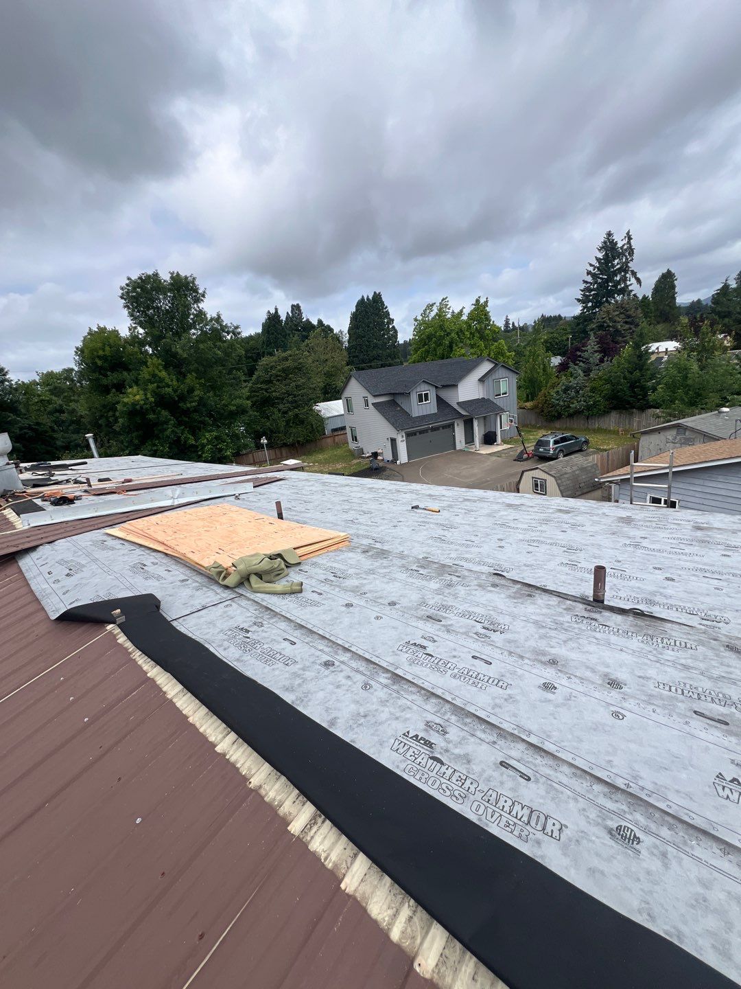 Commercial Flat Roof Installation using Bruce and Dana Snap Lock Metal (Color: Brown) by Orezona Building & Roofing Company, Inc.