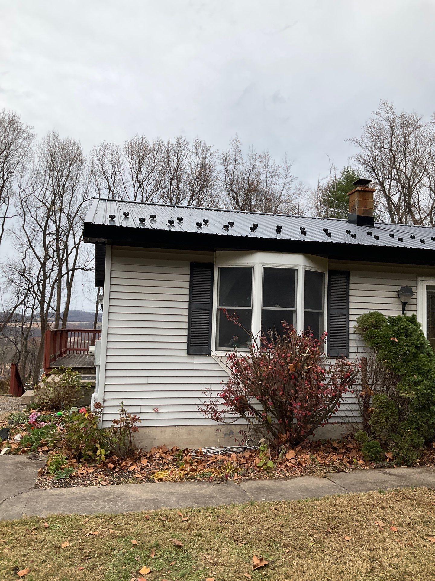 Dalmatia Metal Roofing and Custom Timber Entry Portico by Esh Builders