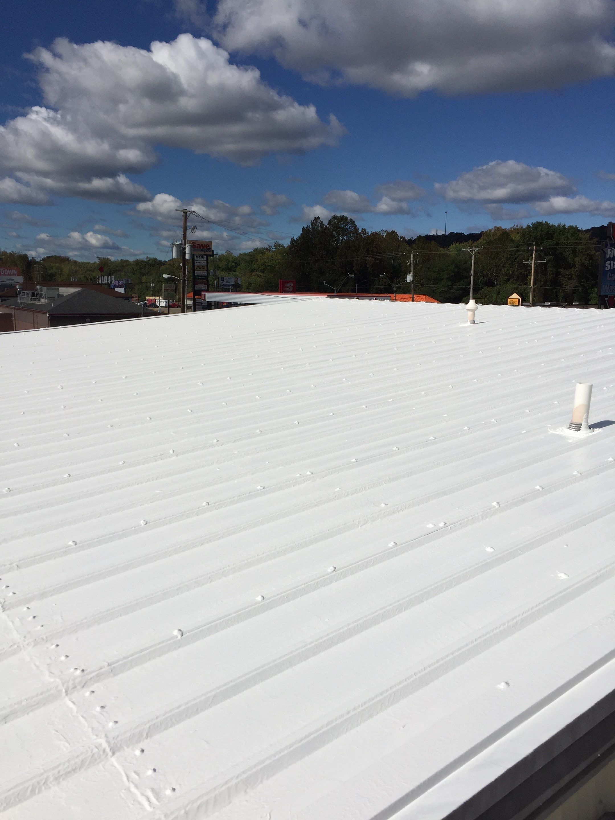 Commercial Roof Coating using Gaco Silicone Roof Coating by Secure Construction Company Inc