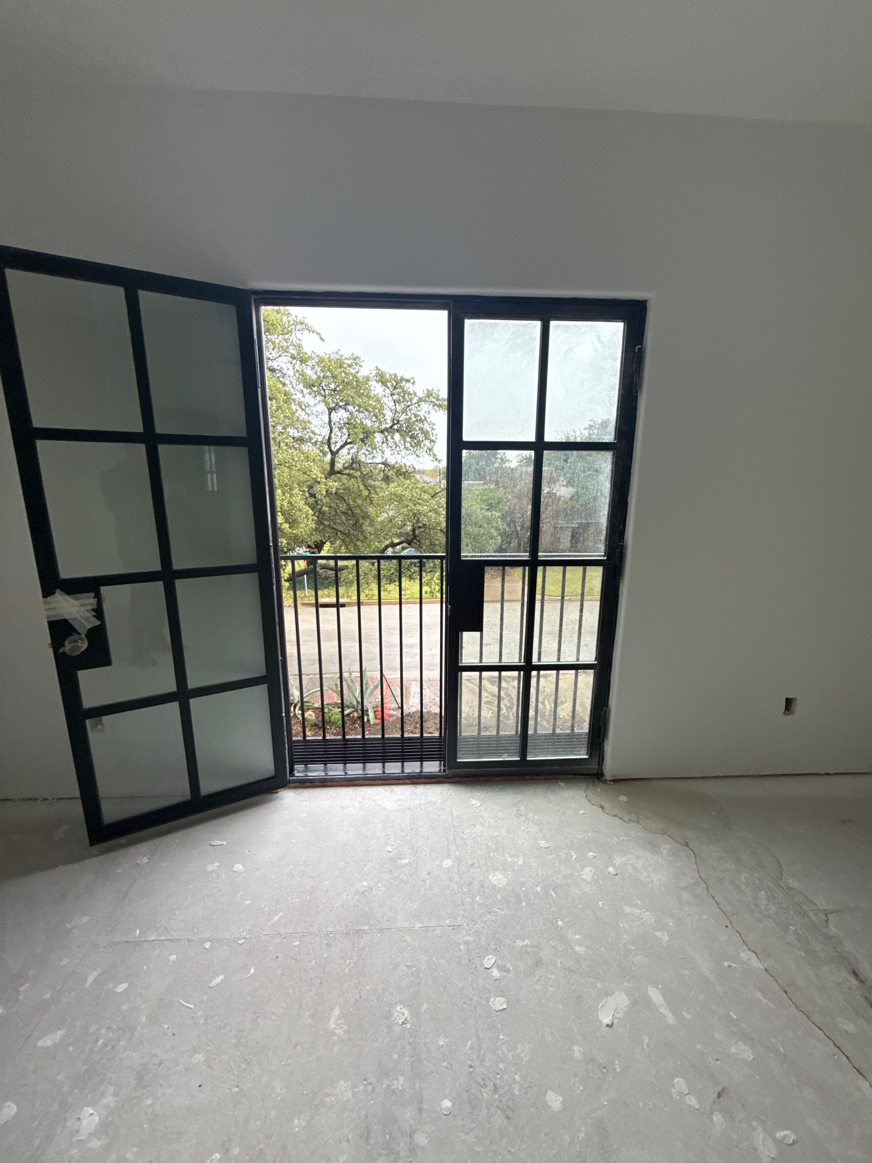 Arched Black Metal French Door Installation and Finishing in Fort Worth by Solara Custom Living