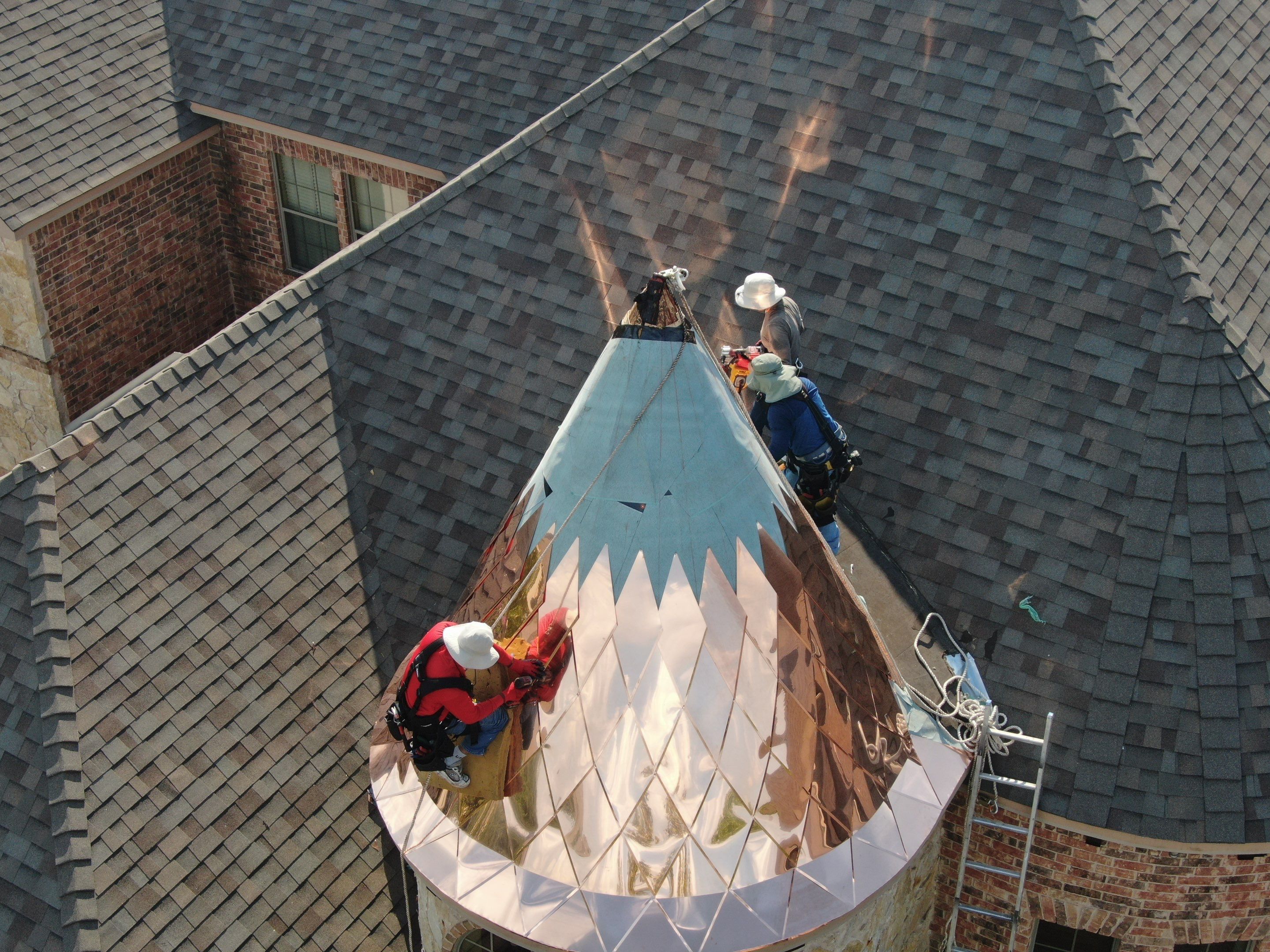 Installing Custom copper turret and Malarkey Vista Class 4 shingles Hail Damage Upgrade by Becker Roofing and Exteriors