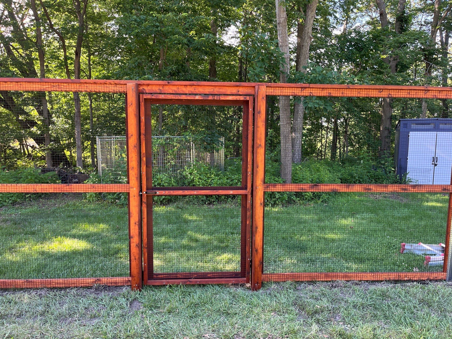 Stained Cedar Mahogany Garden Fence and Raised Bed Enclosure in Cedar Falls by Perfect Picket Fence and Stain