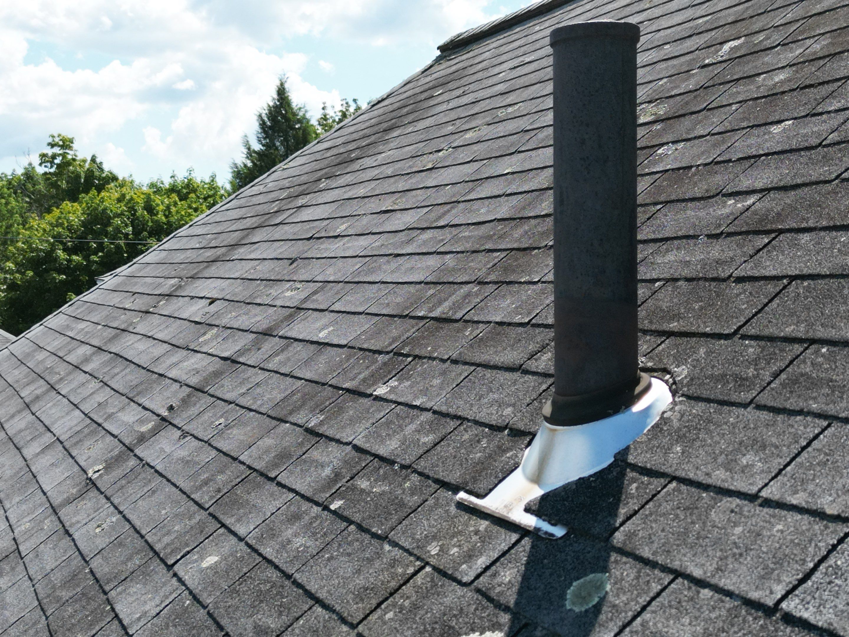 Roof Replacement with Skylight Flashing in Waltham, MA by Mighty Dog Roofing of Greater Middlesex County