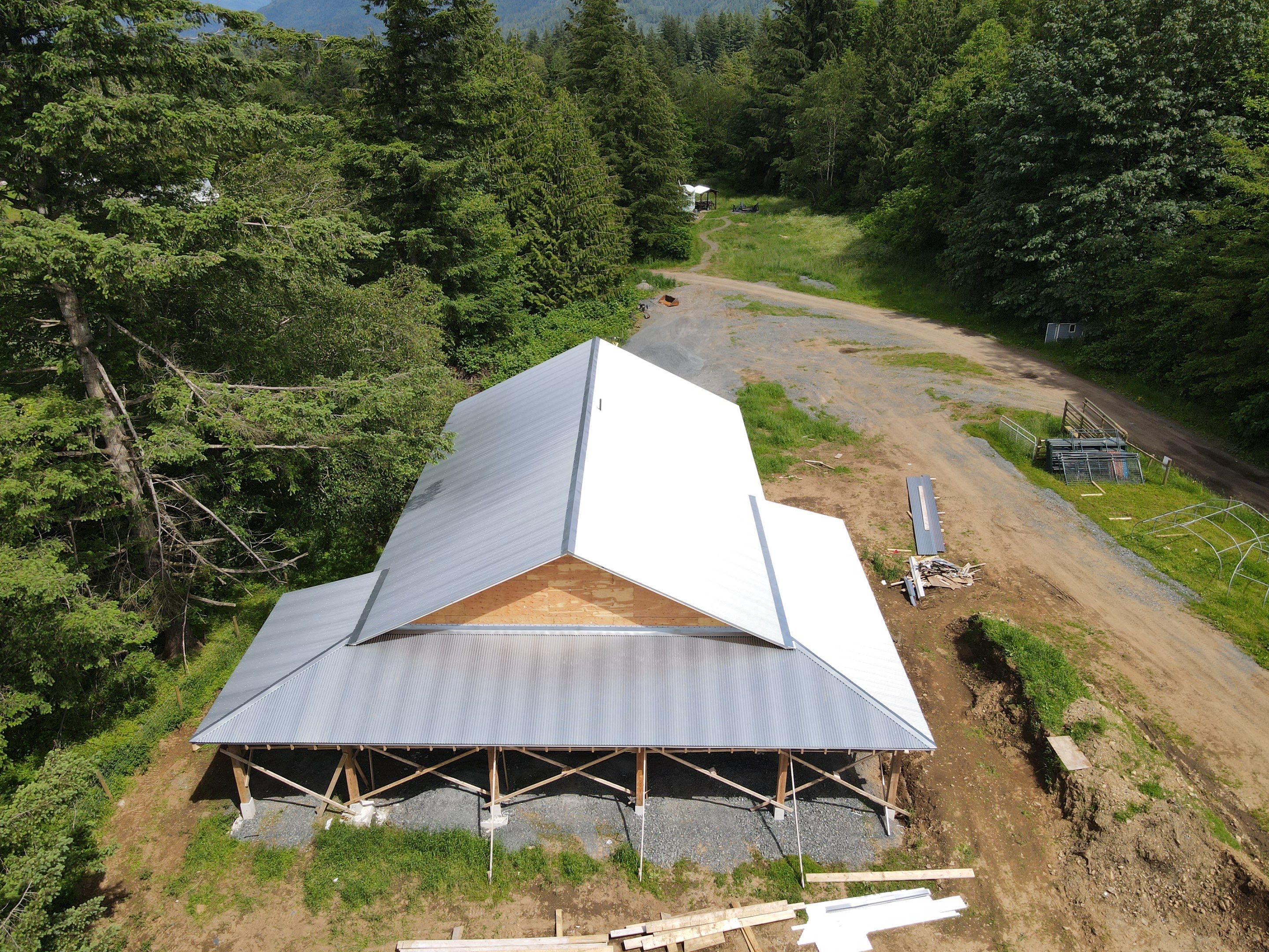 Commercial Roofing Installation using corrugated metal by Top Notch Roofing Inc
