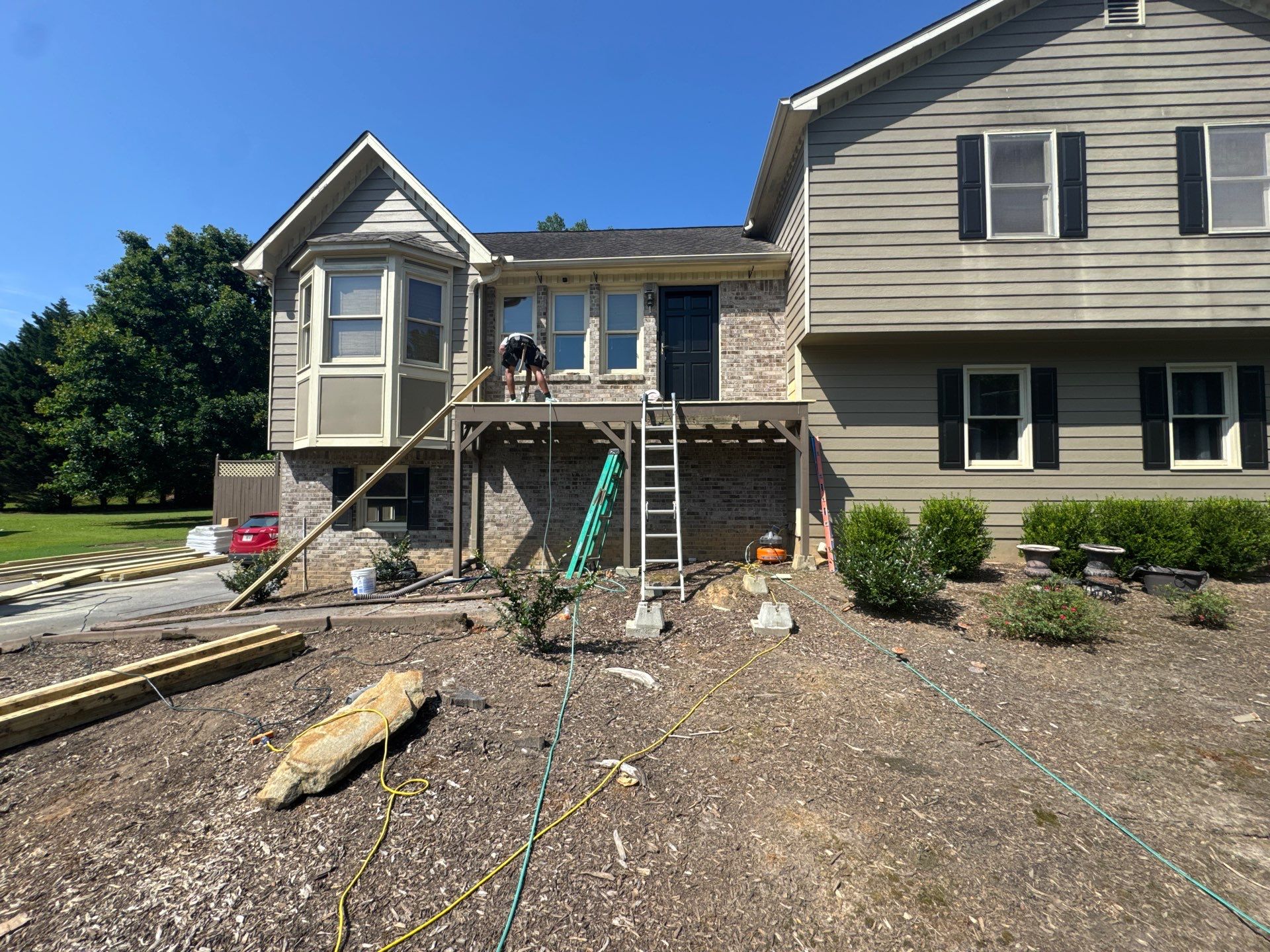 Elevated Pressure-Treated Deck and Staircase Build in Powder Springs by Swift Home Renovations