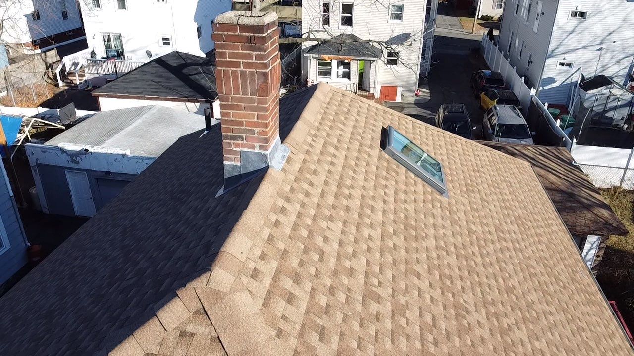 Roof Installation Roof Type: Hip Roof  Multi Family Home- 2 Story by Delarosa Construction & Design