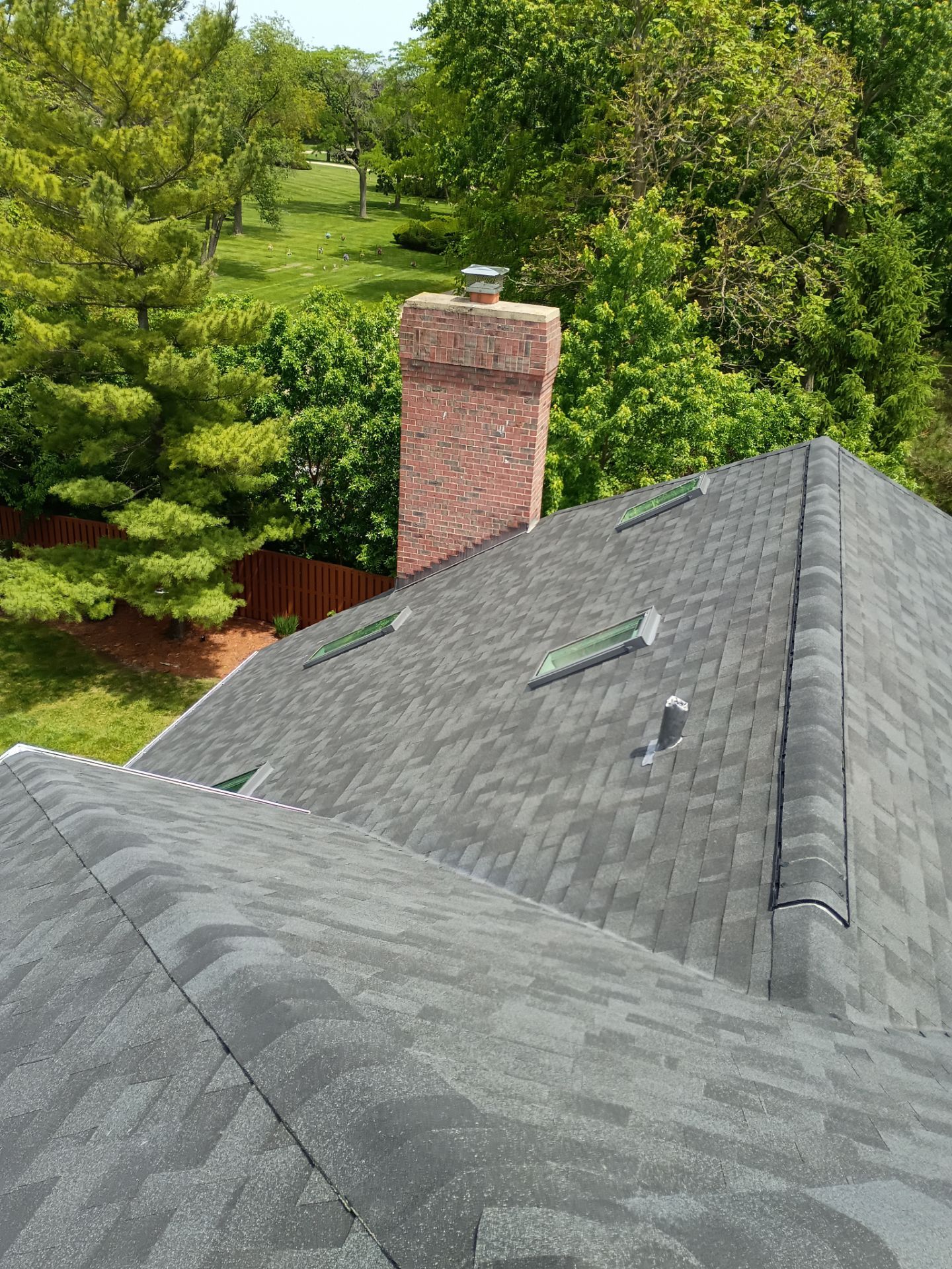 Asphalt Shingle Roof Replacement and Skylight Installation in Darien by Pro Home Services Inc