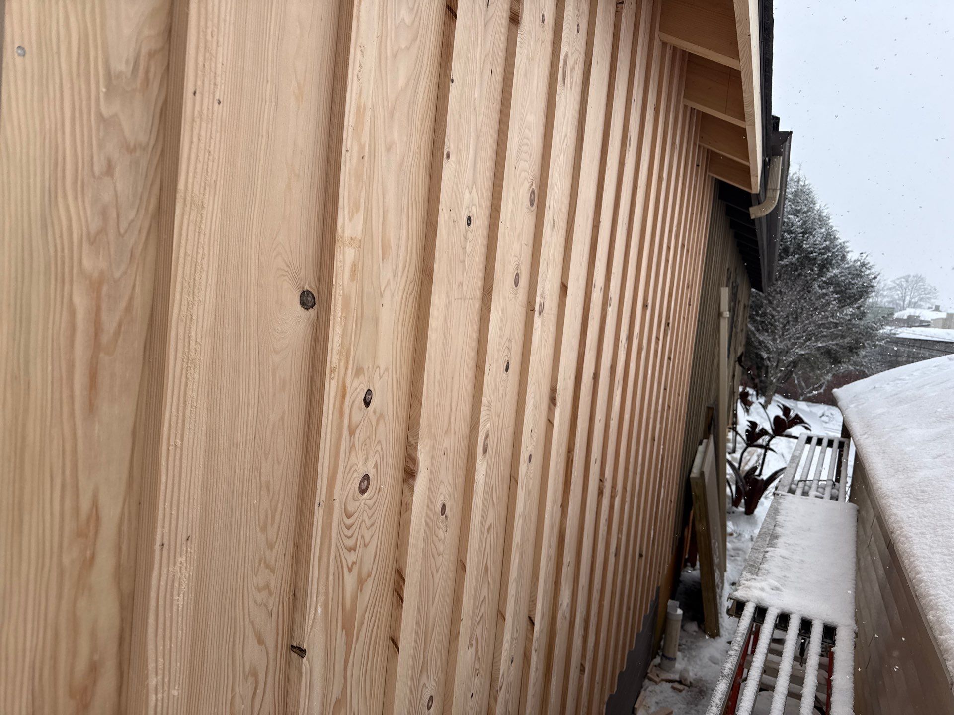 Custom Composite Deck with Stone Fireplace and Modern Cable Railing by Walnut Hollow Decks & Outdoor Living