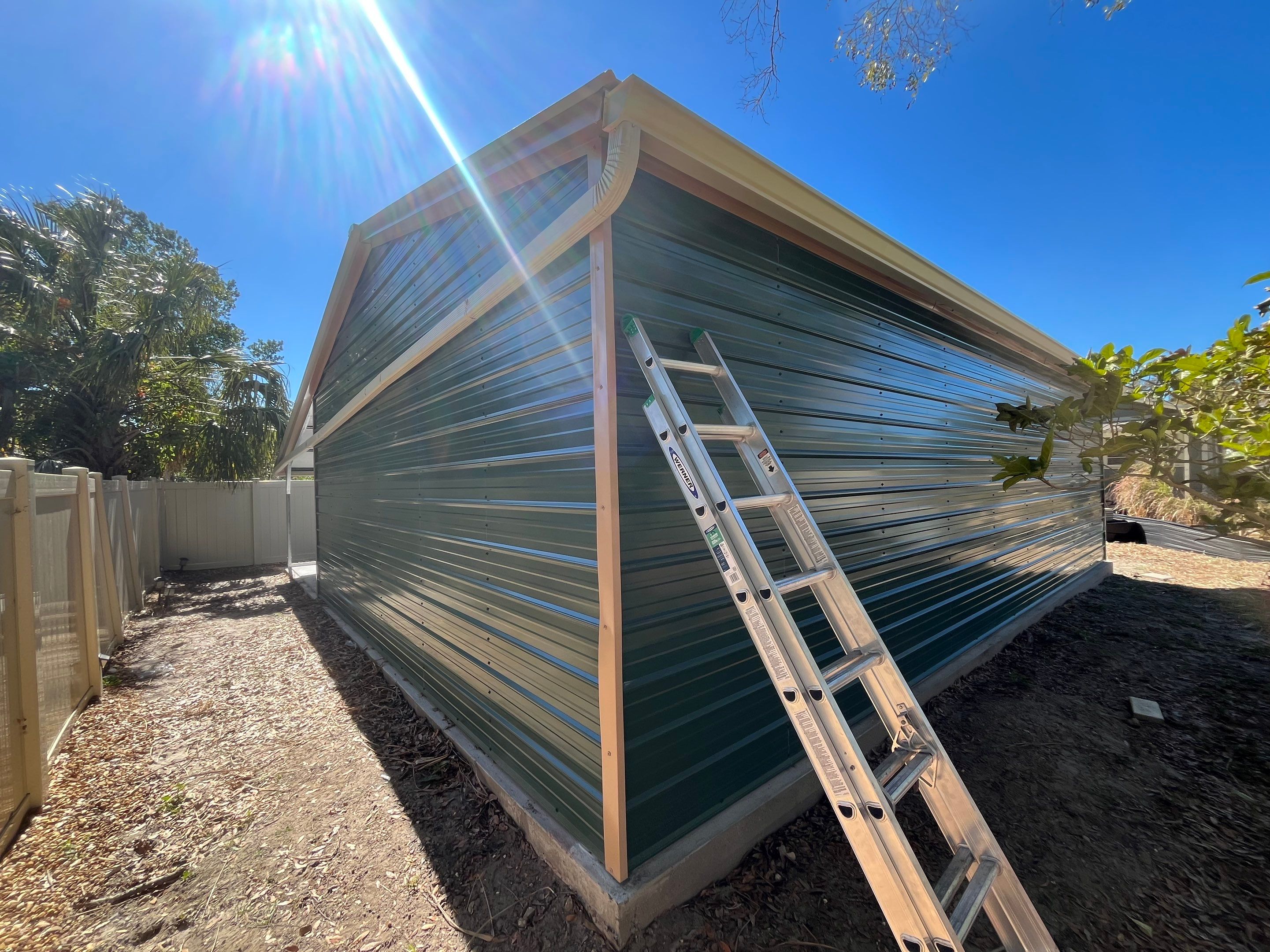 White 6-inch K-style Gutters and Down Spouts using Seamless Gutters White Down Spouts in Tampa FL by Gutter Professors