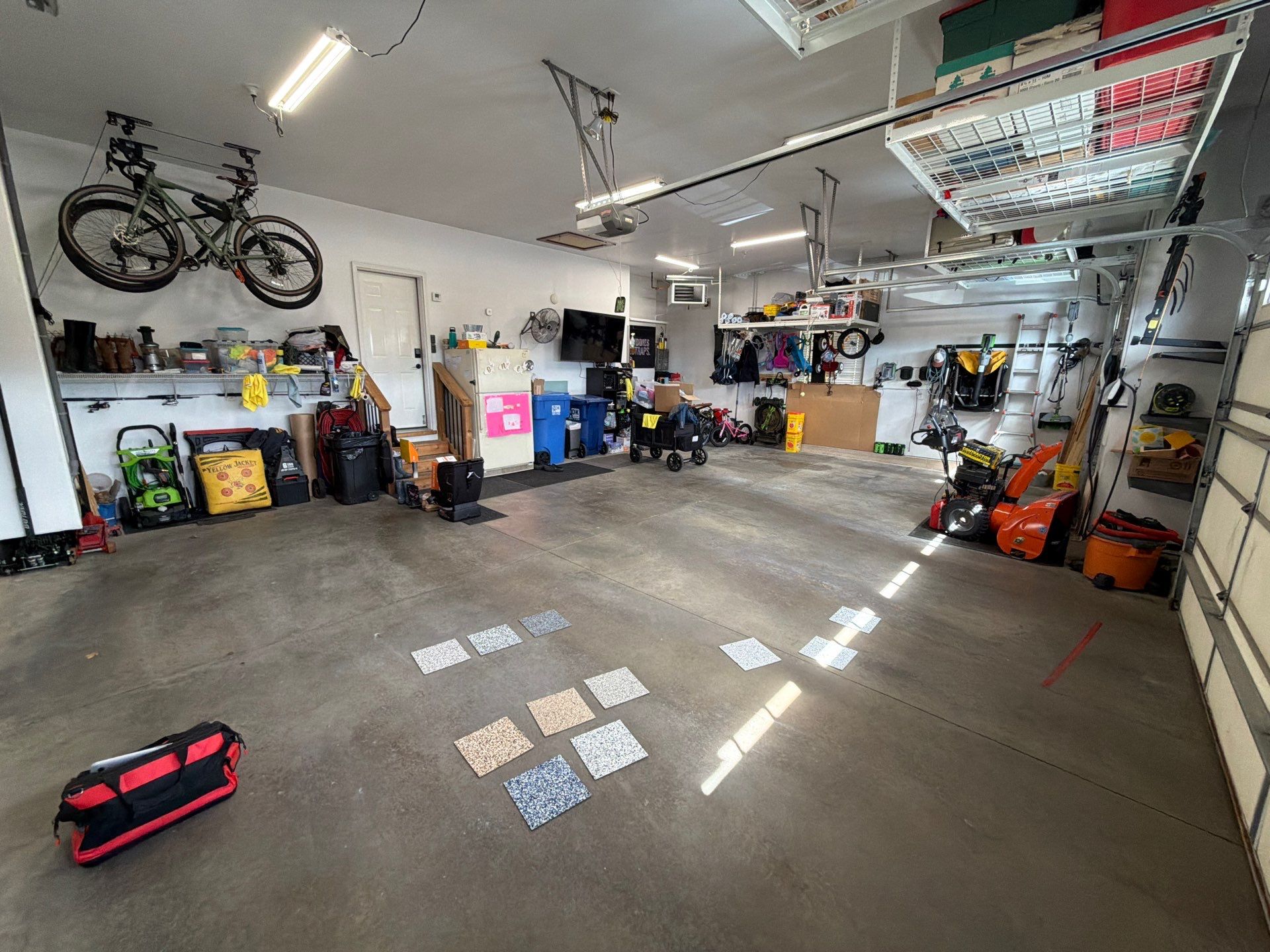 Feather Gray Epoxy Floor Coating Installation in Sioux Falls by Select Painting, Coatings & Garage Cabinets