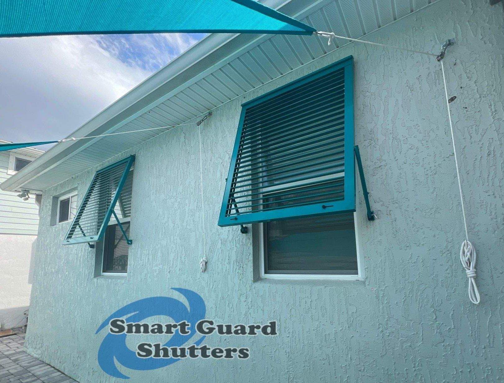 Impact Bahama Shutters in Water Blue by Smart Guard Shutters