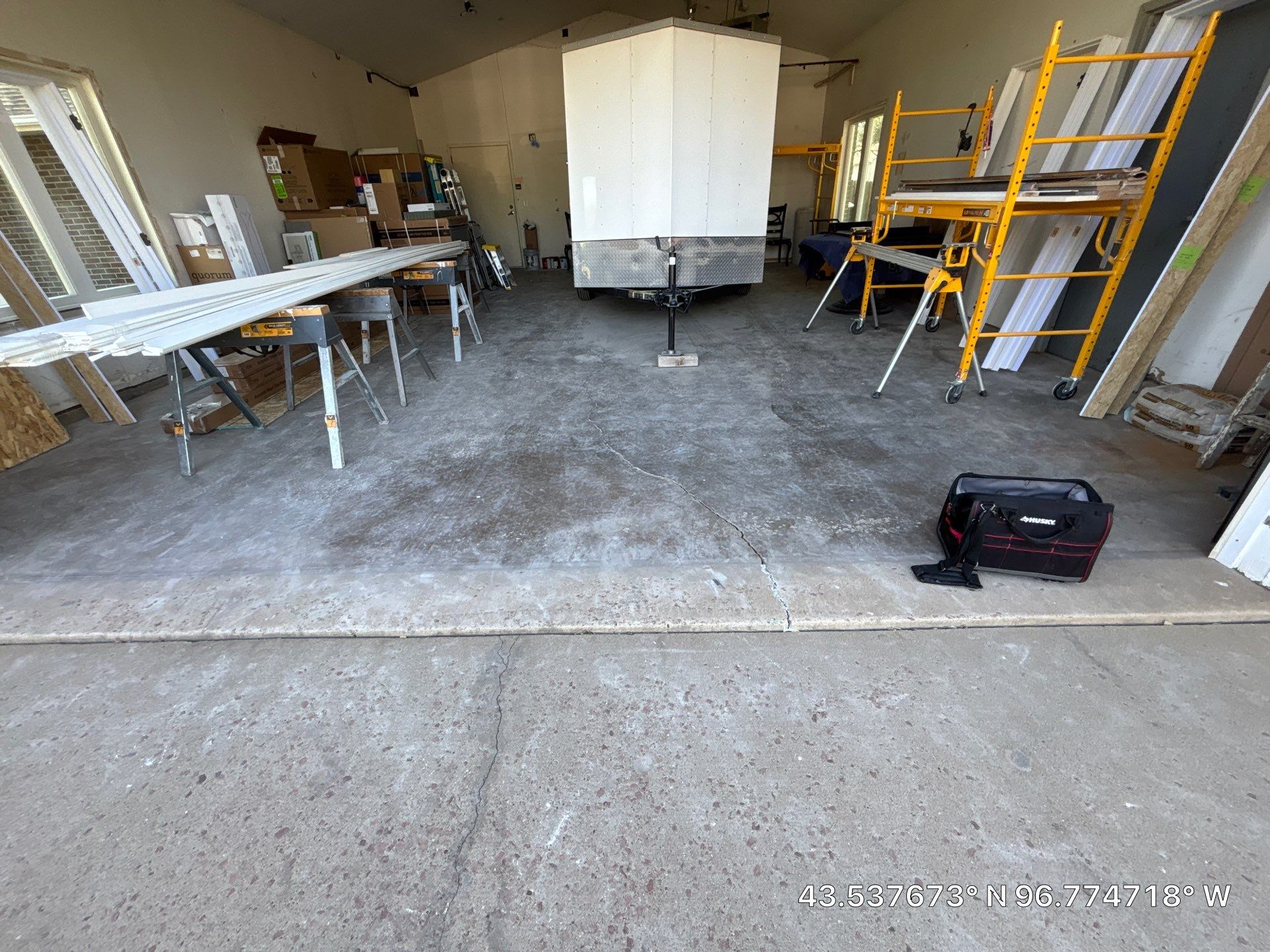 Coyote Flake Concrete Coating for Sioux Falls Garage by Select Painting, Coatings & Garage Cabinets