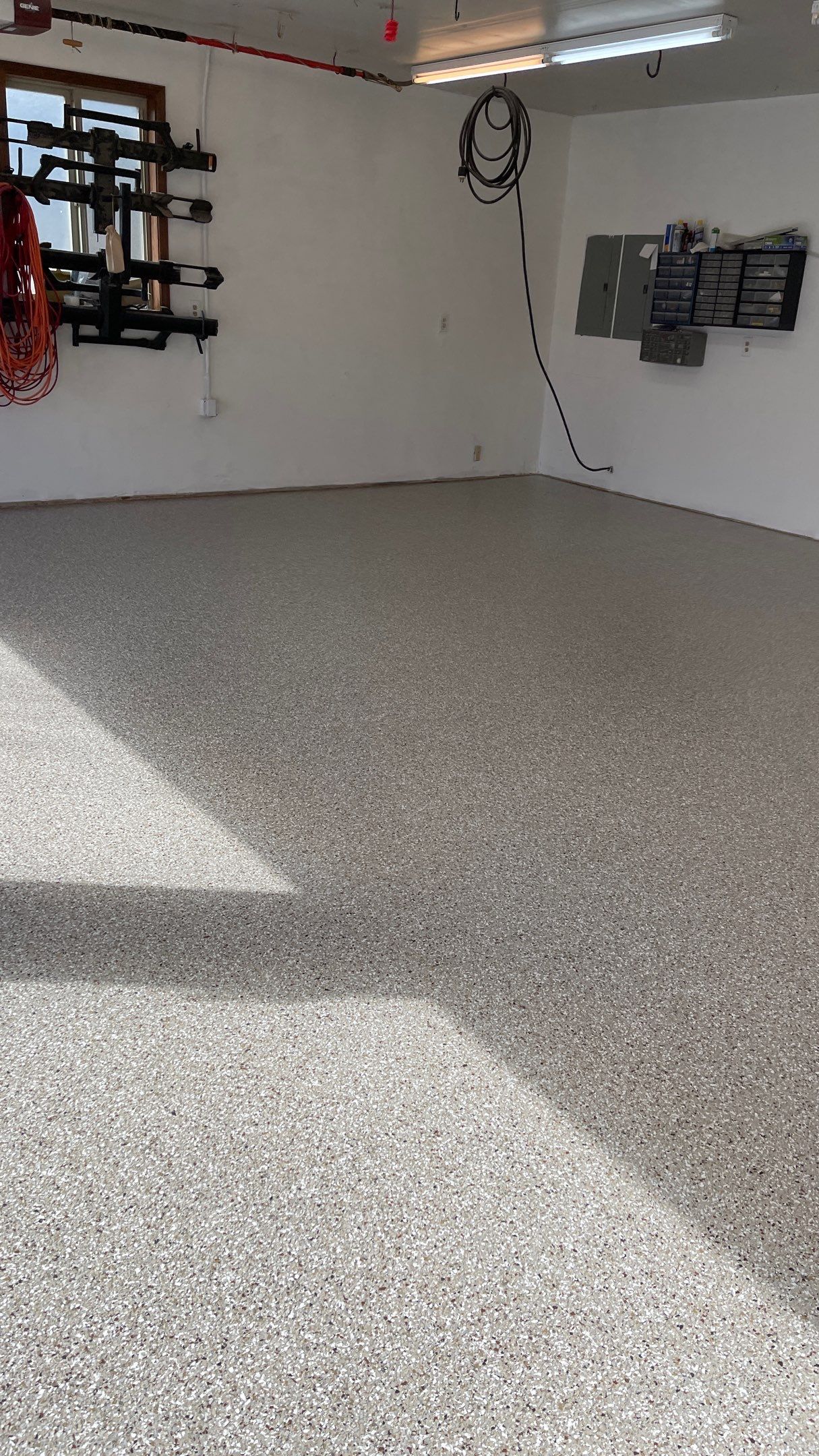 Garage Floor Polyaspartic Coating with Pebble Beach 1/4" Flakes by Croc Coatings, LLC