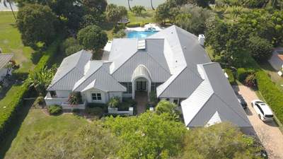 Residential Roofing Installation using 1" Nail strip metal roof