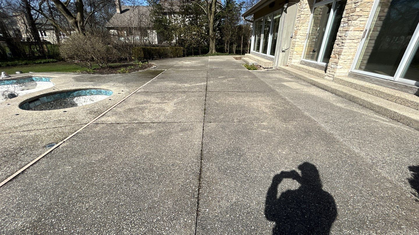 Aggregate Clean and seal using low gloss sealer by Northern Power Washing LLC.
