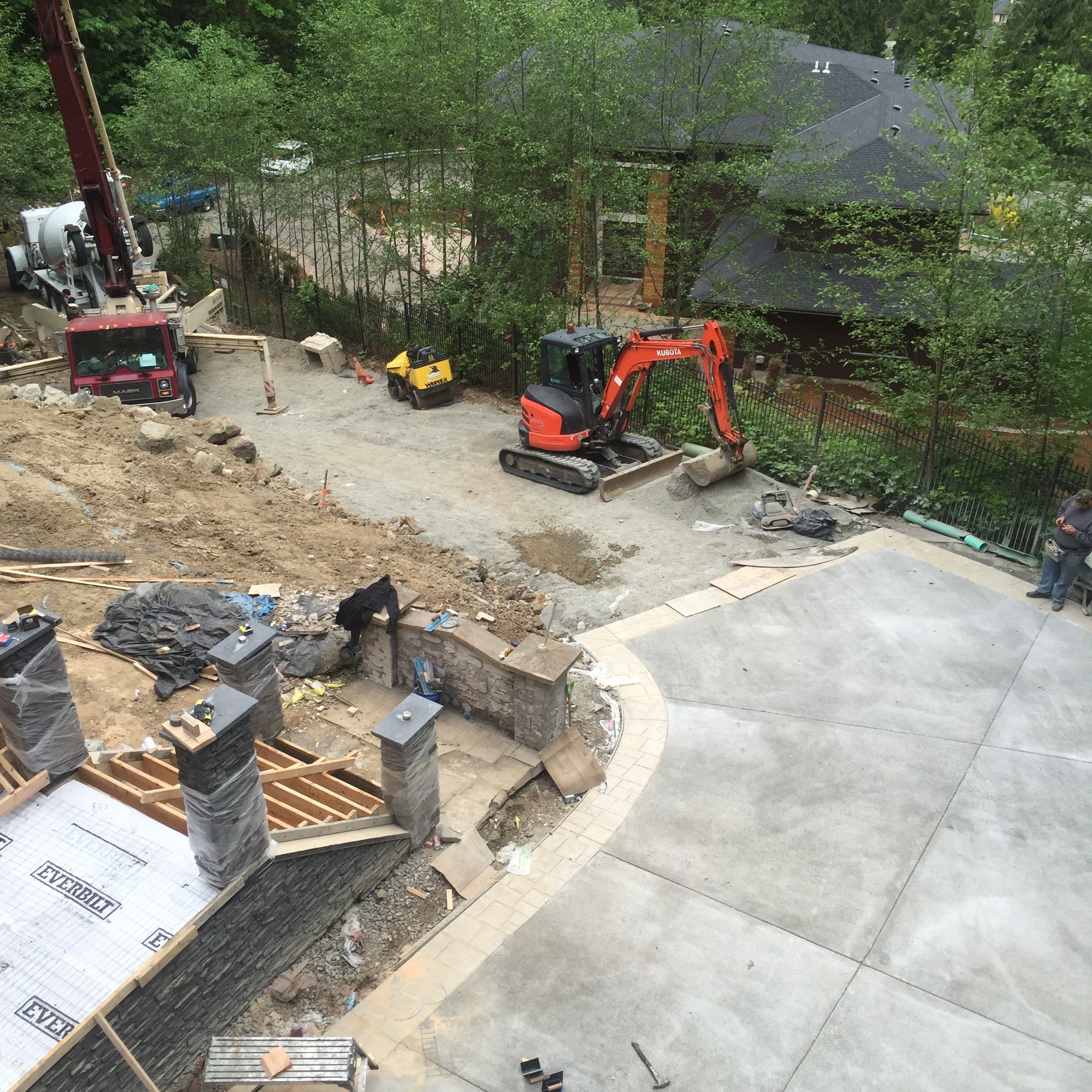 Asphalt Driveway and Stamped Concrete Patio Finish  by Jireh Asphalt & Concrete Inc 