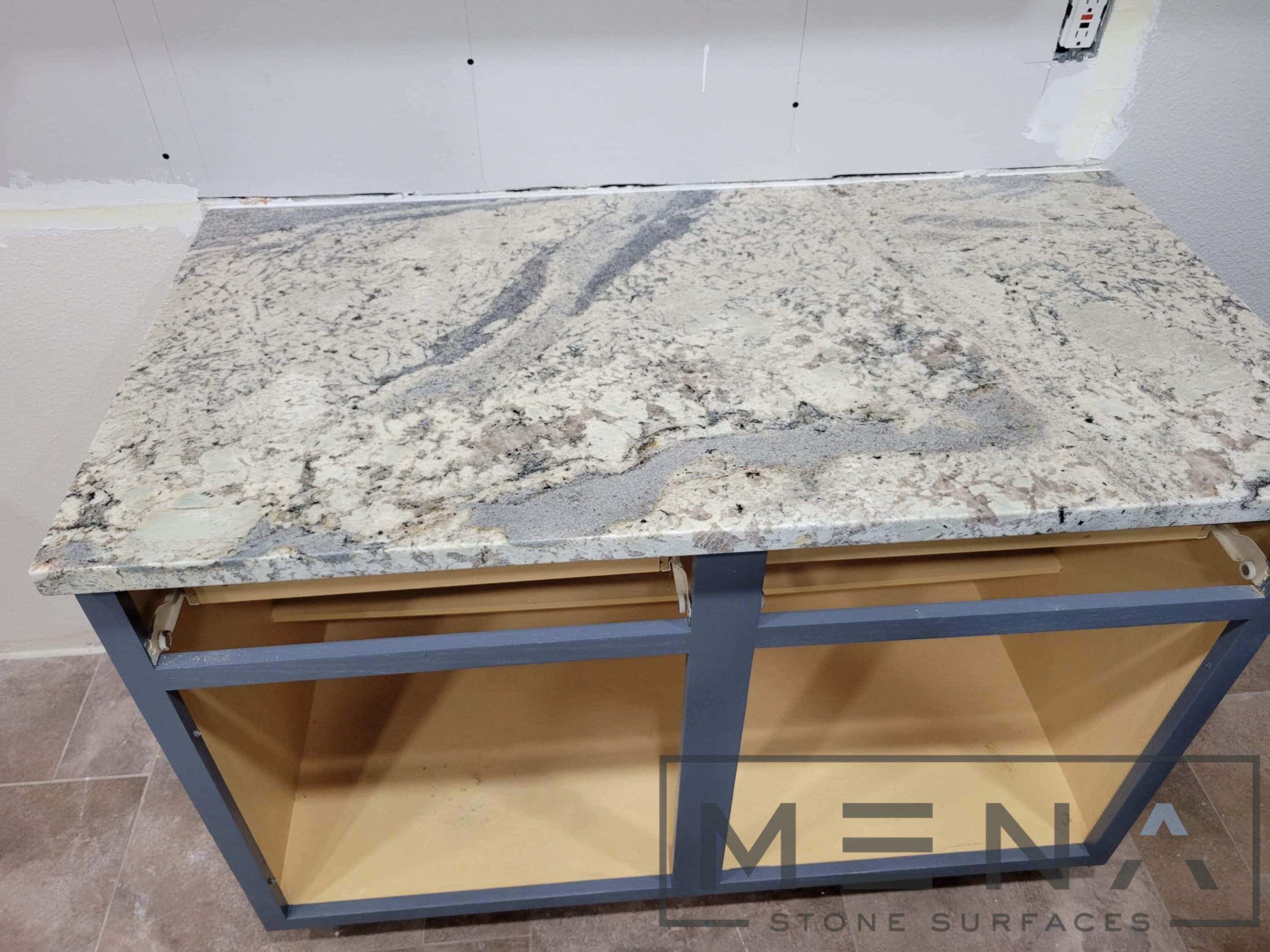 Kitchen countertops using Alaska Blue Granite by Mena stone surfaces