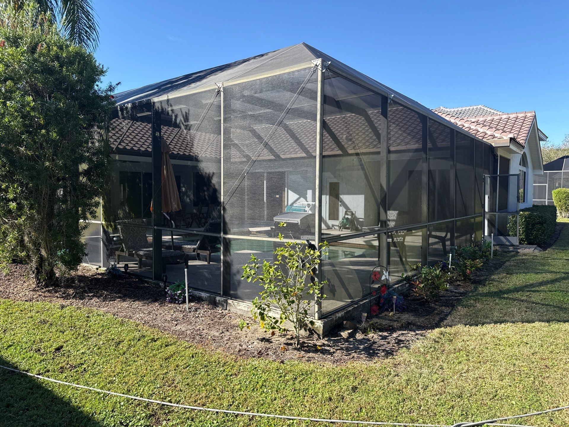 Painted Pool Deck, Lanai & Pool Cage Cleaning in River Club South – Bradenton, FL by Sunshine AquaWash
