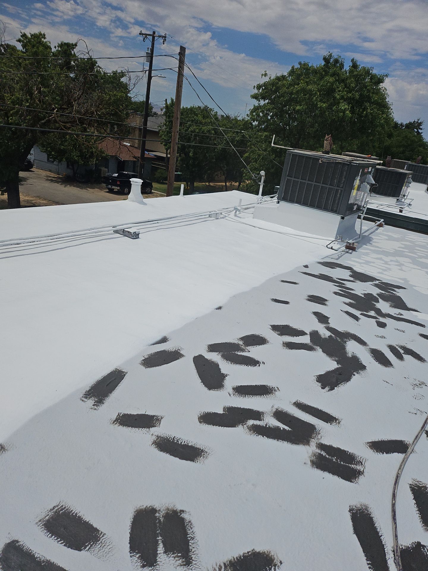 Foam Refurbish using General Coatings acrylic coatings and spray foam by Straight Edge Roofing Inc