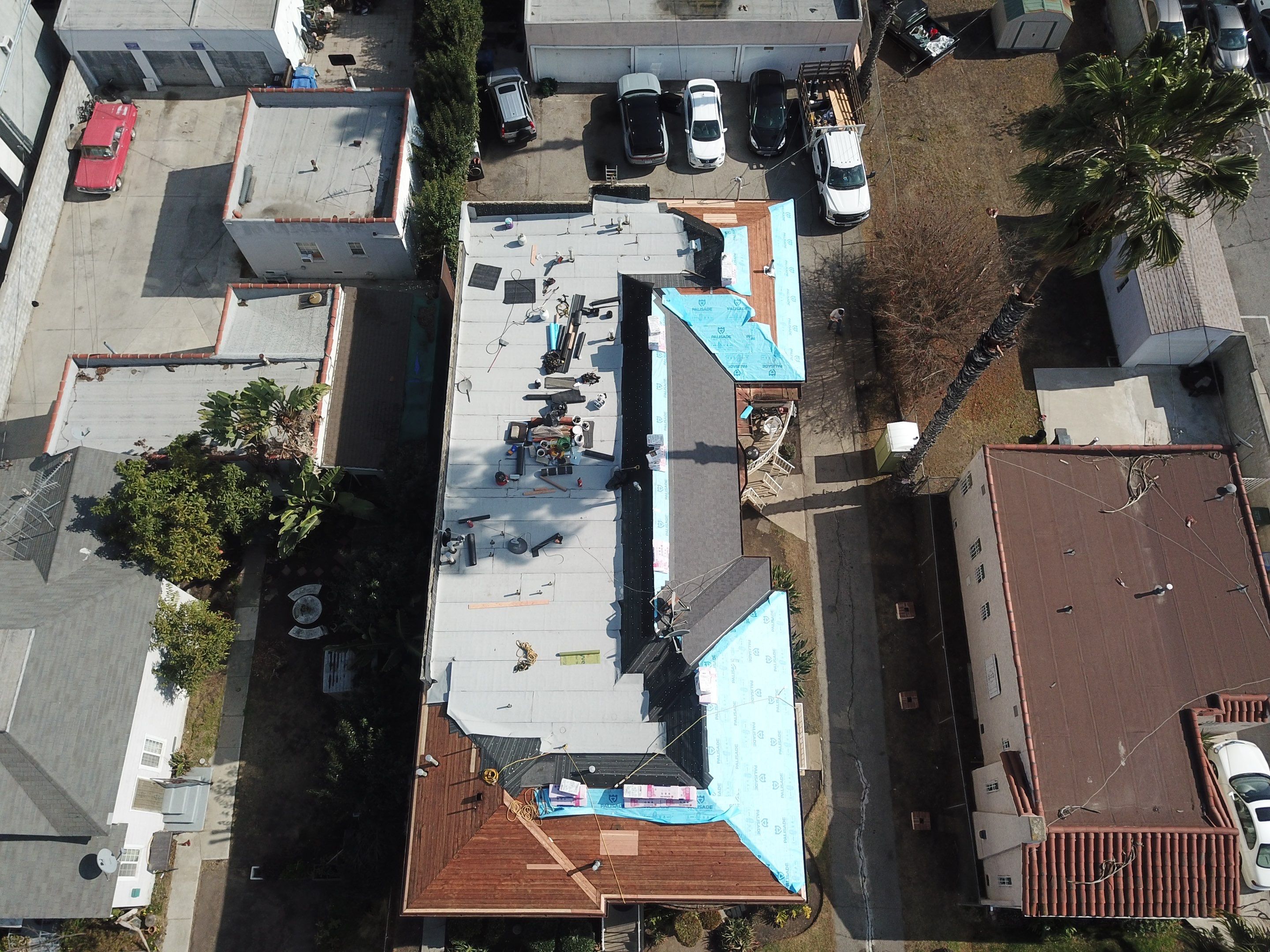 Apartment Building Roofing Installation using CertainTeed GTA Modified Bitument System by Hull Brothers Roofing