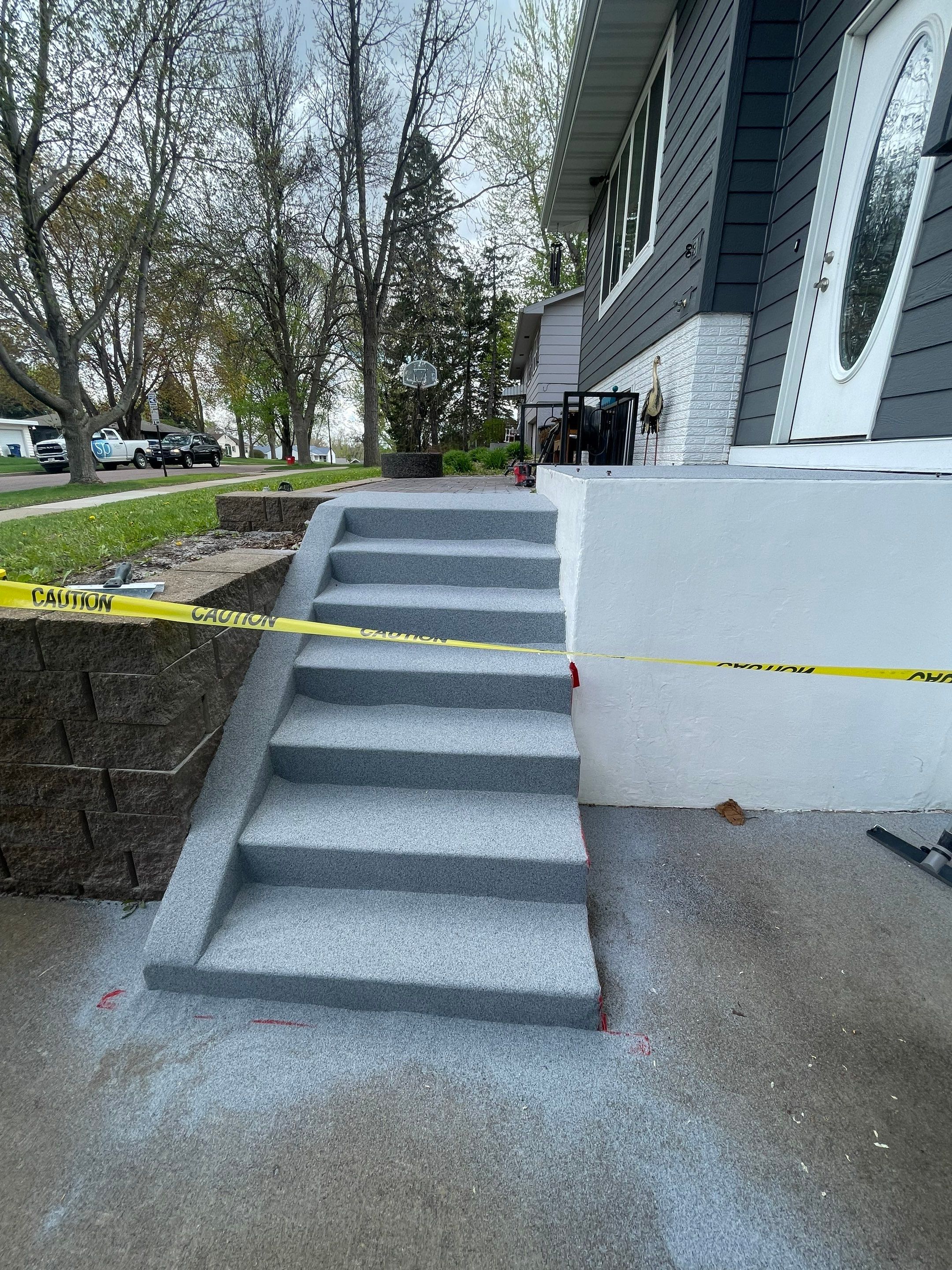 Grey Polyaspartic Porch and Stair Resurfacing in Sioux Falls by Select Painting, Coatings & Garage Cabinets