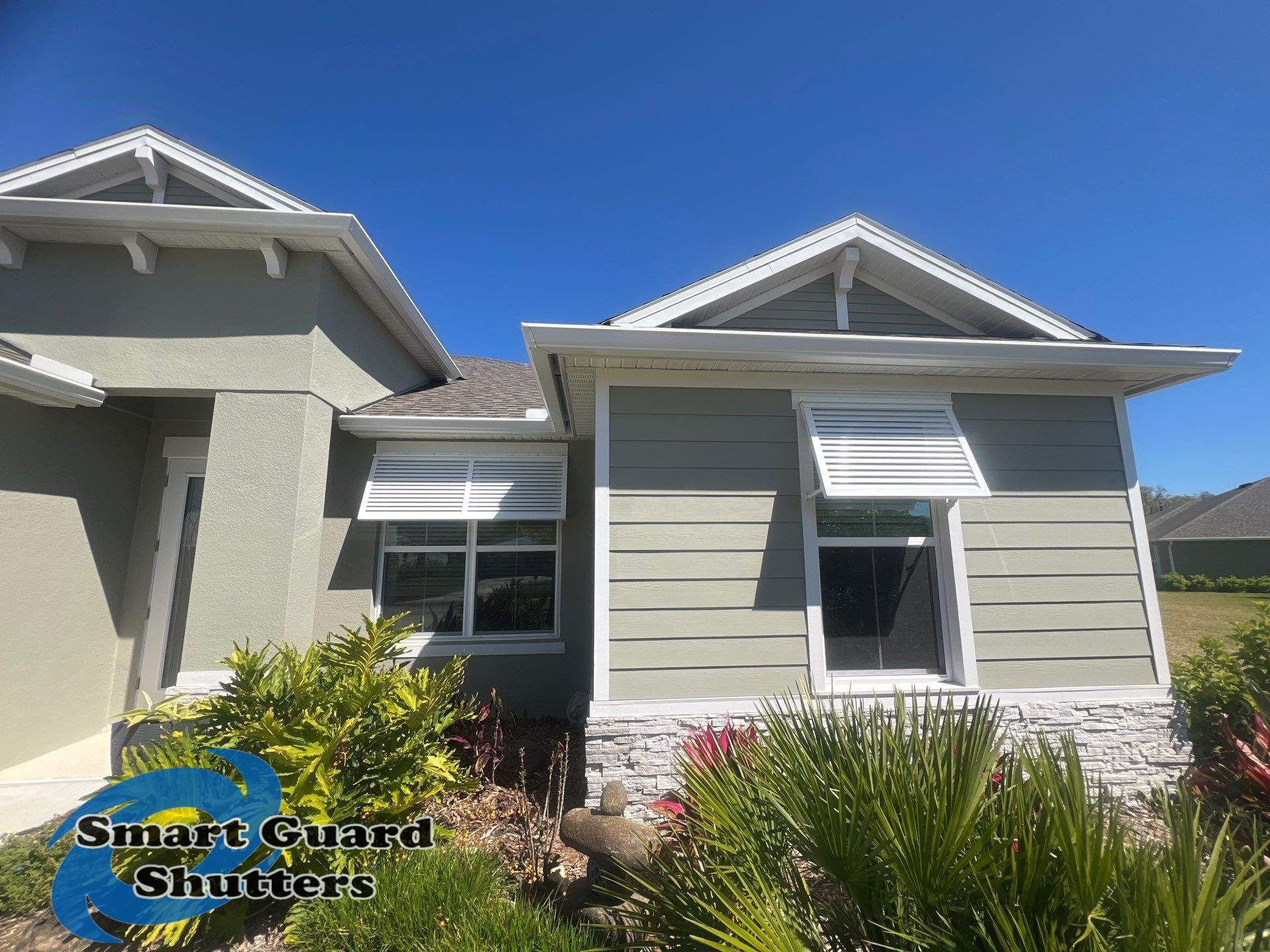 Decorative Bahama Shutters in Signal White by Smart Guard Shutters