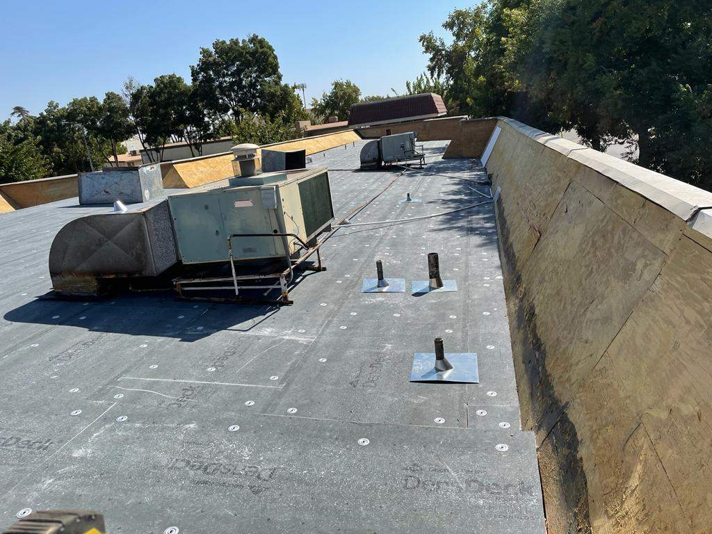 Commercial Roofing Installation using General Coatings acrylic coatings and spray foam by Straight Edge Roofing Inc