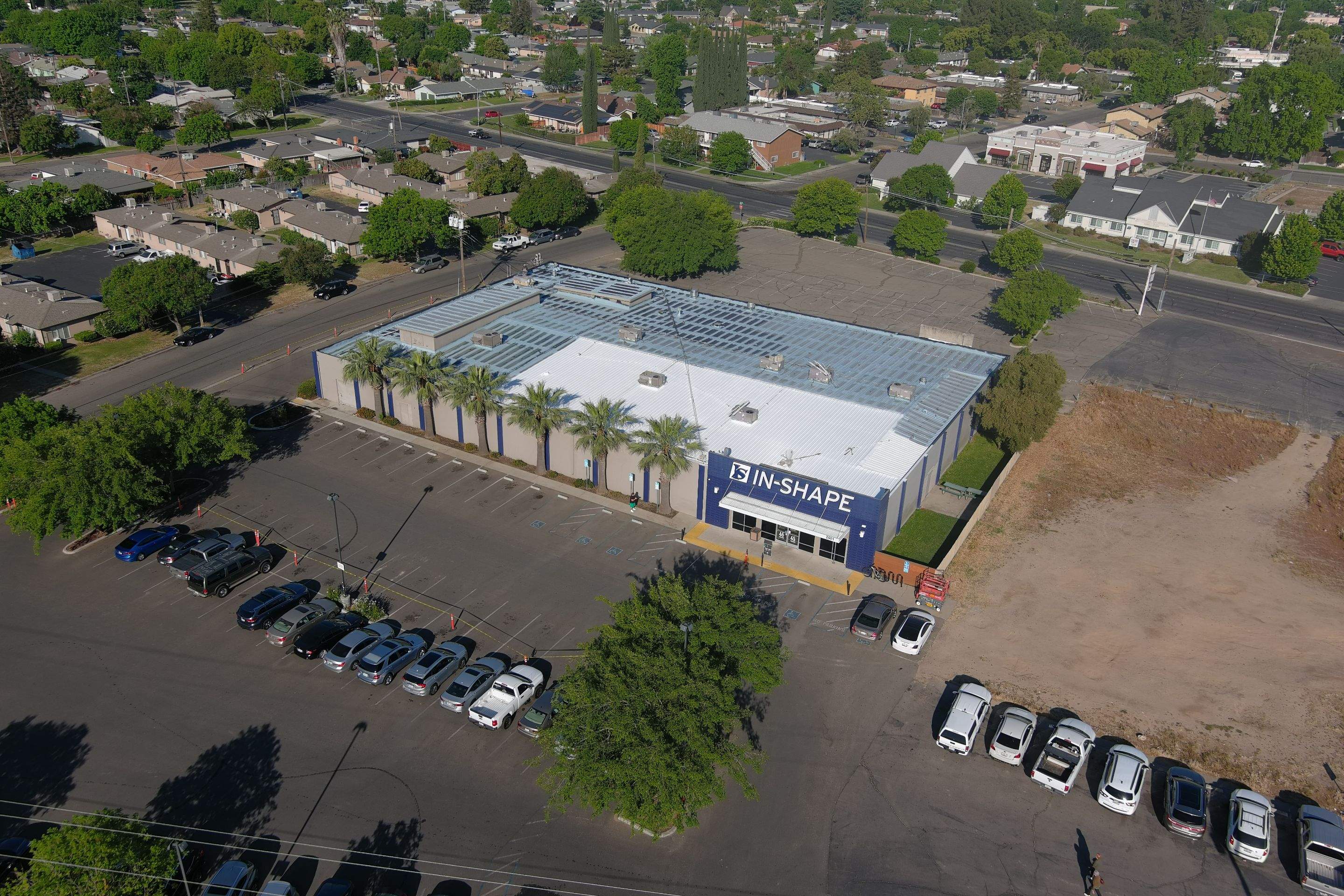 Metal roof restoration on commercial roof using Conklin Benchmark/ PUMA XL acrylic coatings over metal and foam by Straight Edge Roofing Inc