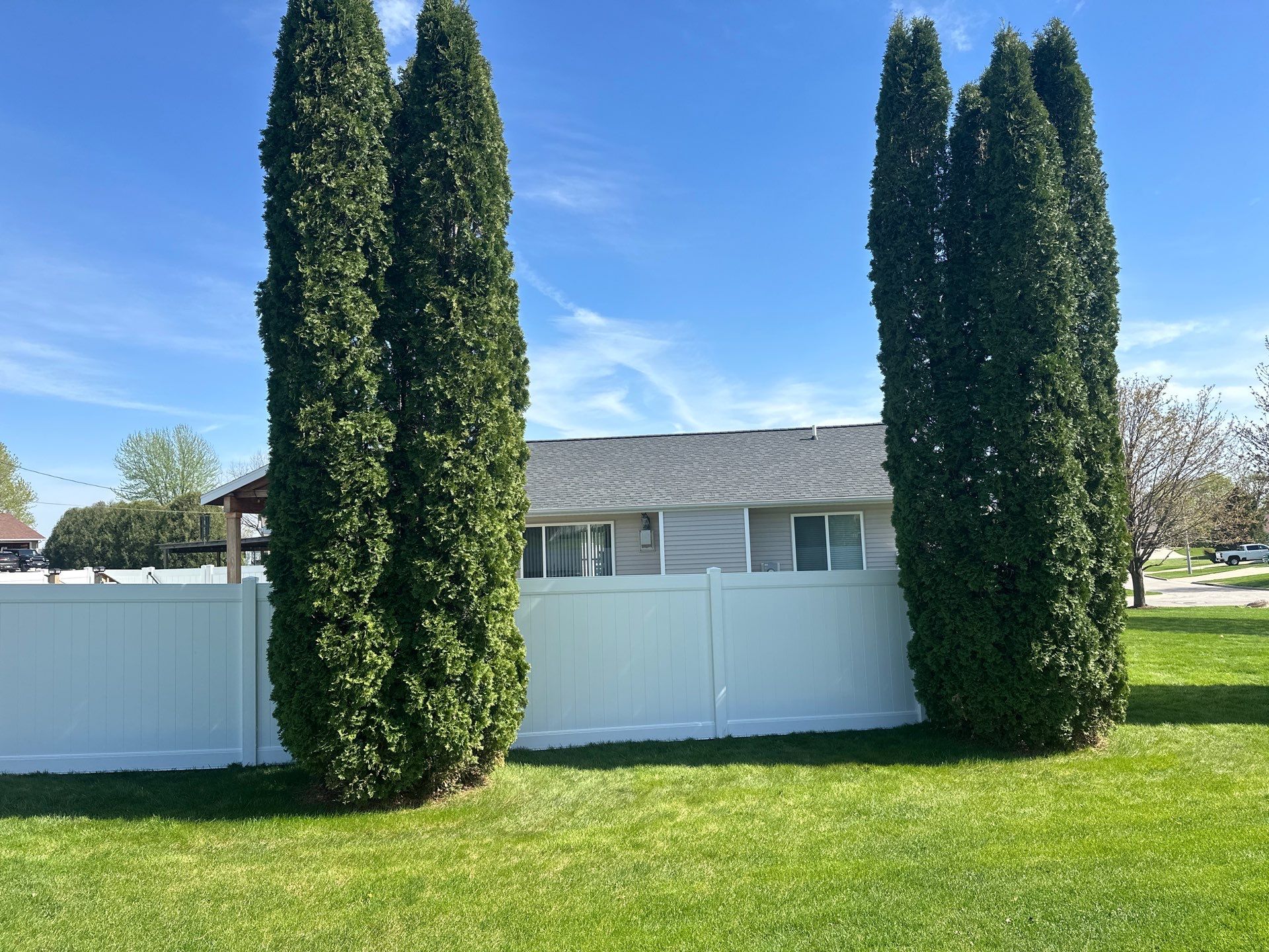 White Vinyl Privacy Fence Installation in Raymond, Iowa by Perfect Picket Fence and Stain