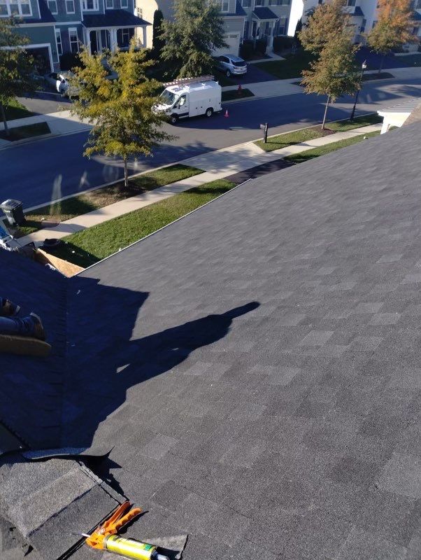 Residential Roofing Installation using Atlas Pinnacle Pristine Black Architectural Shingles by Frederick Roof Repair