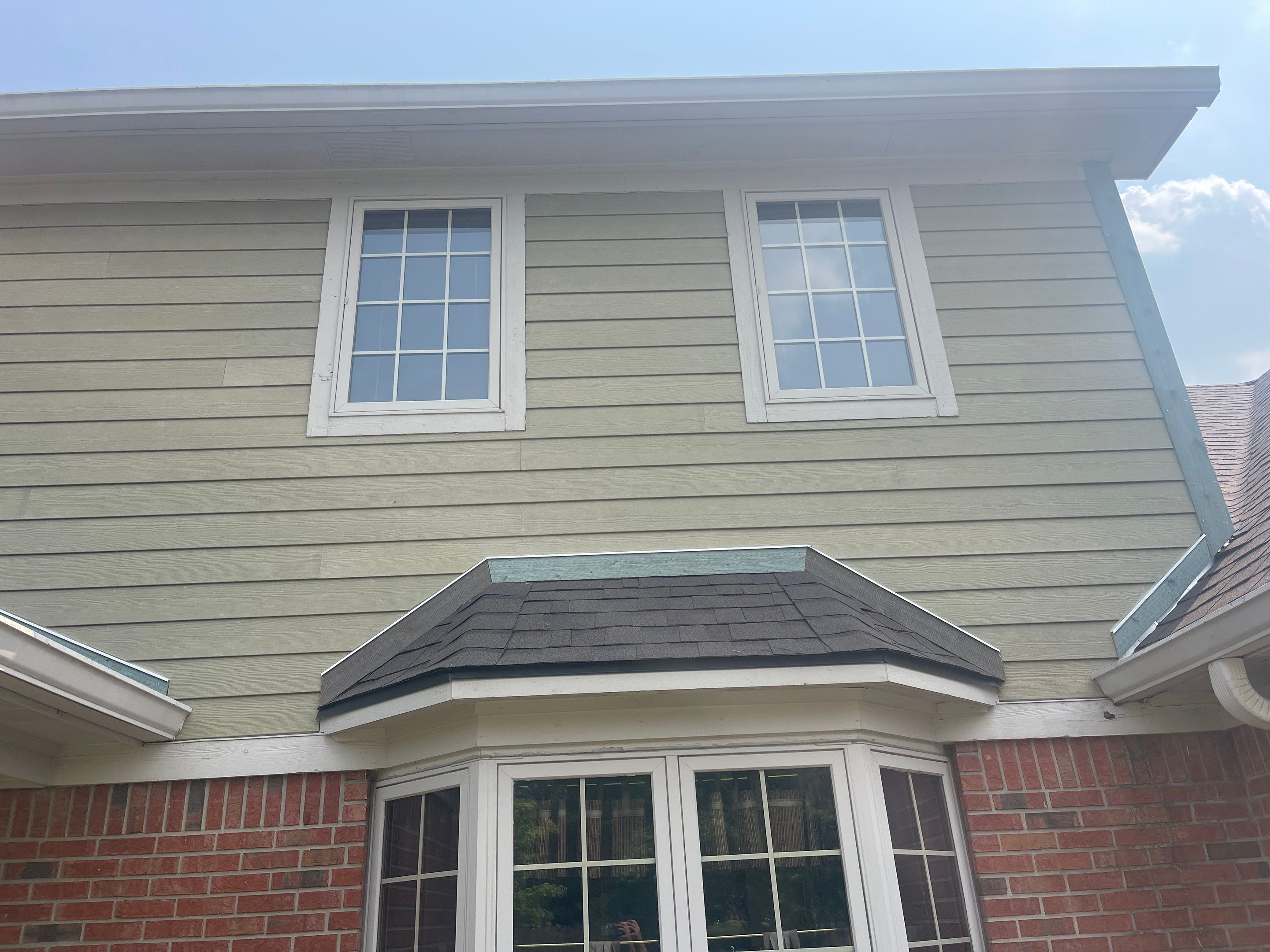 Tornado damage in Whiteland. Roof replacement, James Hardie siding, exterior paint, gutters, windows, doors by 317 Roofing & Restorations