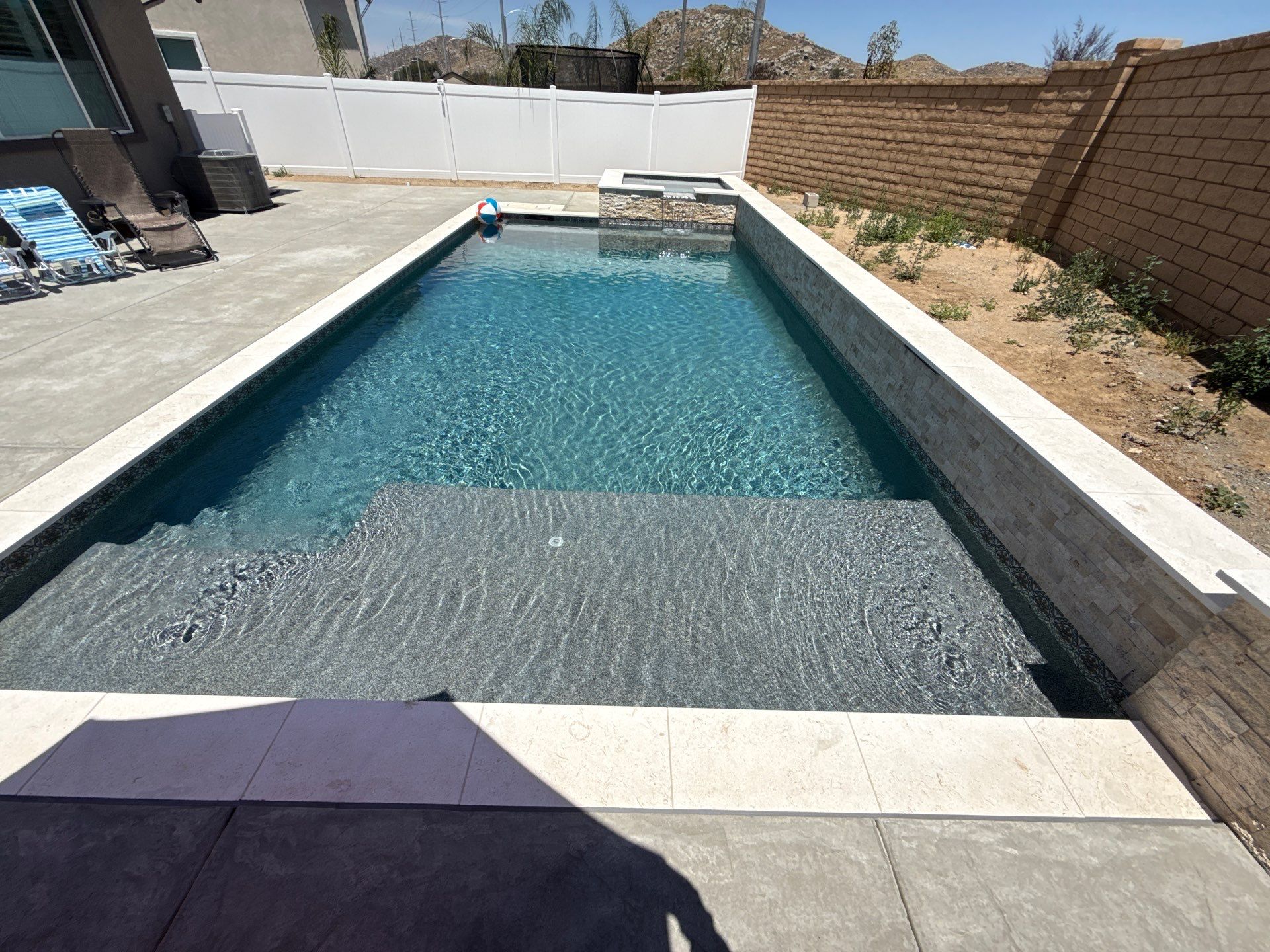 Clean lines with this pool and spa by Premier Pools and Spas Temecula
