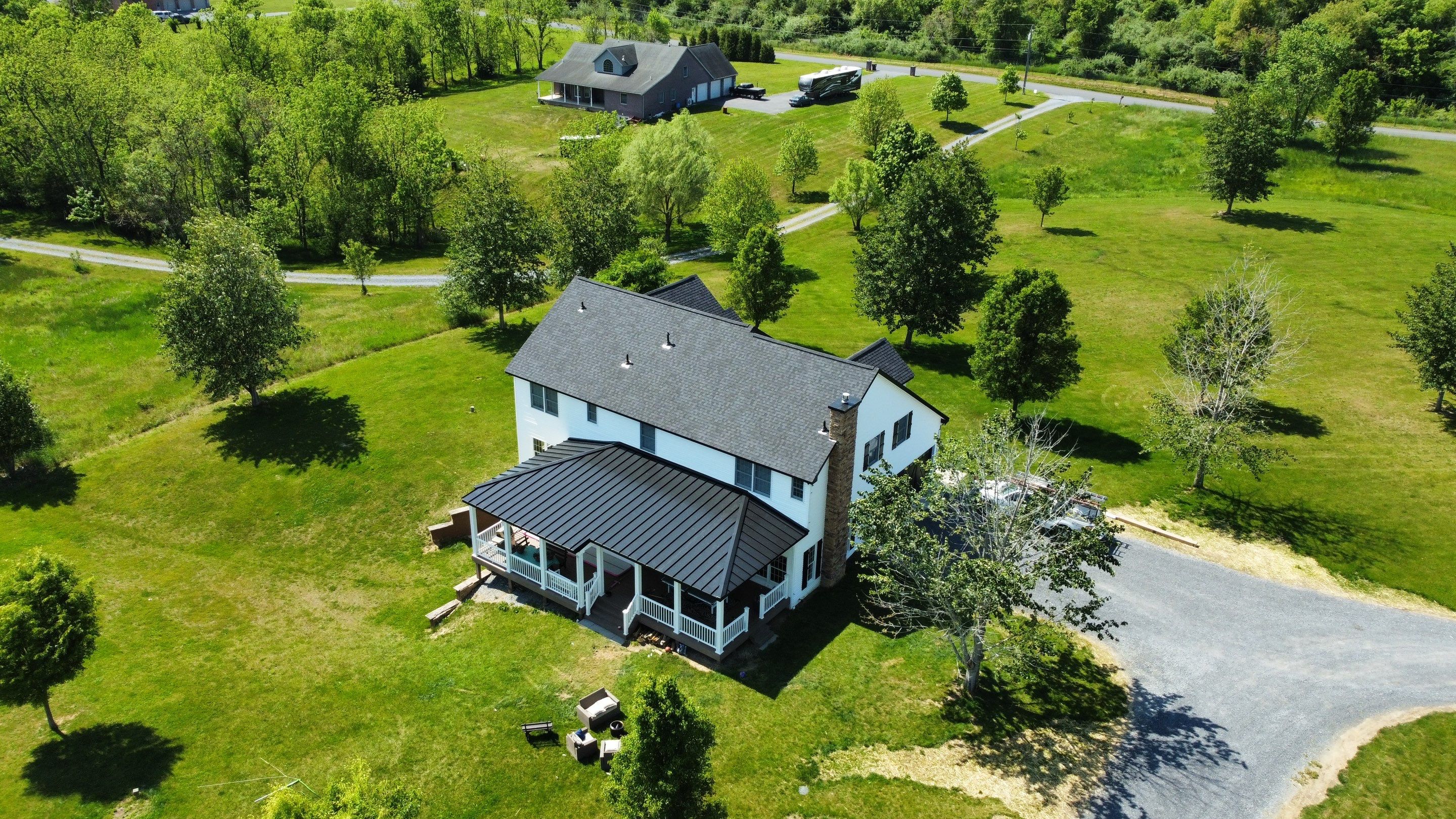 Roof Damage using Certainteed Lifetime Roofing System- Moire Black Landmark Pro shingkes with shadow ridge caps. by BulletpROOF Exteriors