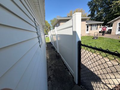 Custom Vinyl Privacy and Black Chain Link Fence Installation in Cedar Falls