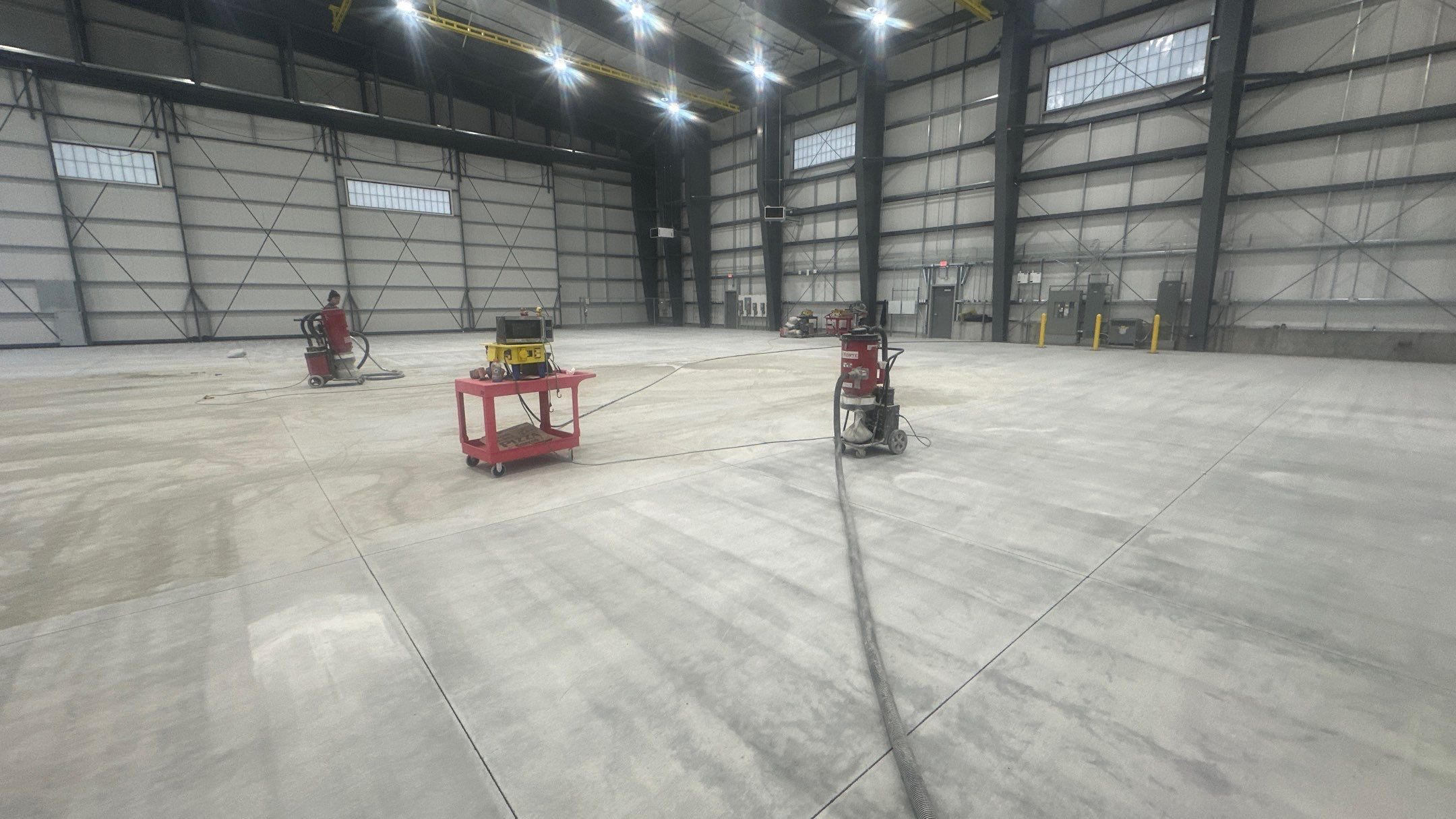 Airplane Hanger using Light Grey Commercial Penntek Epoxy by Croc Coatings, LLC