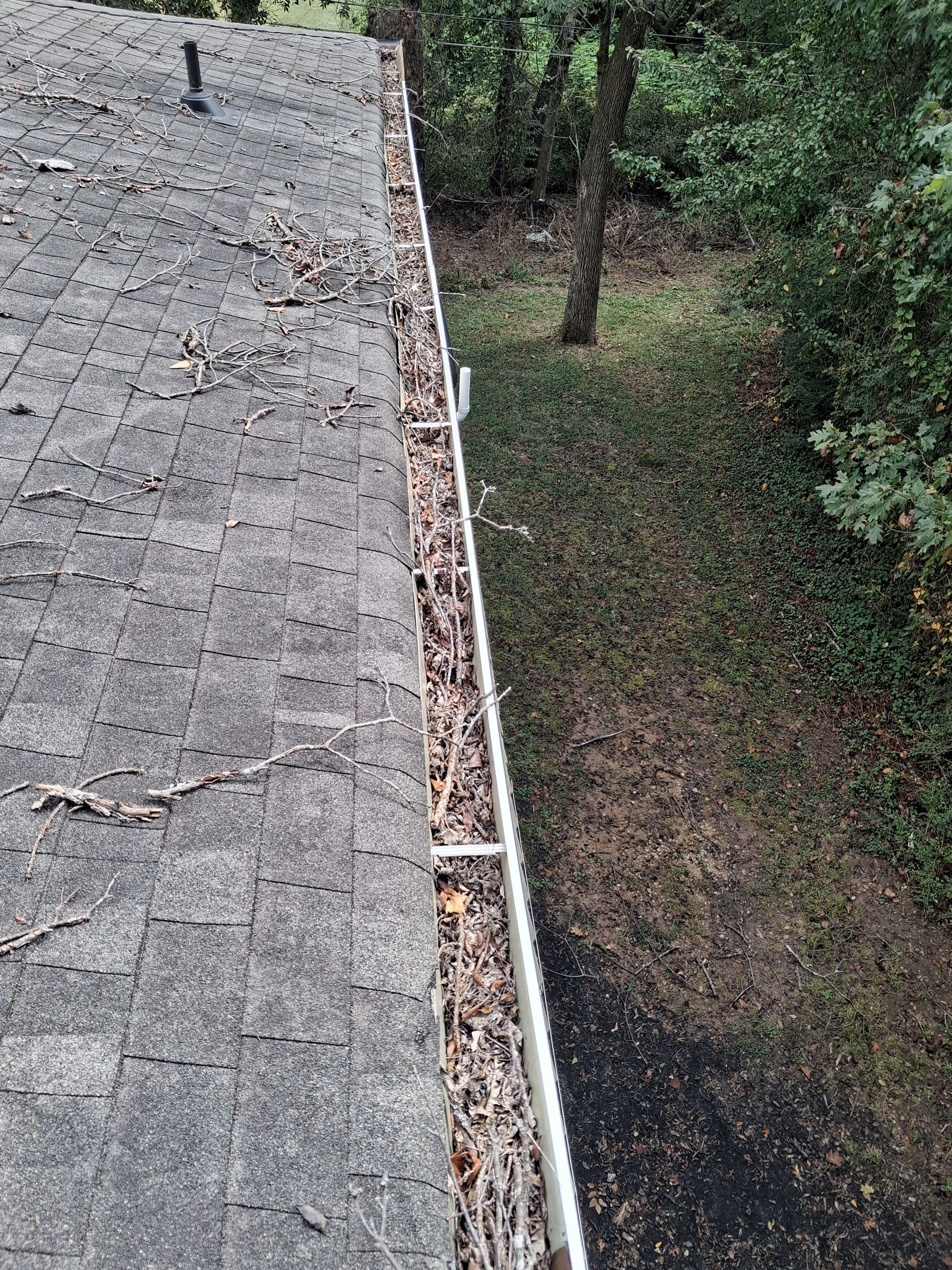 Commercial gutter cleaning Chattanooga, TN before photo with filled gutters
