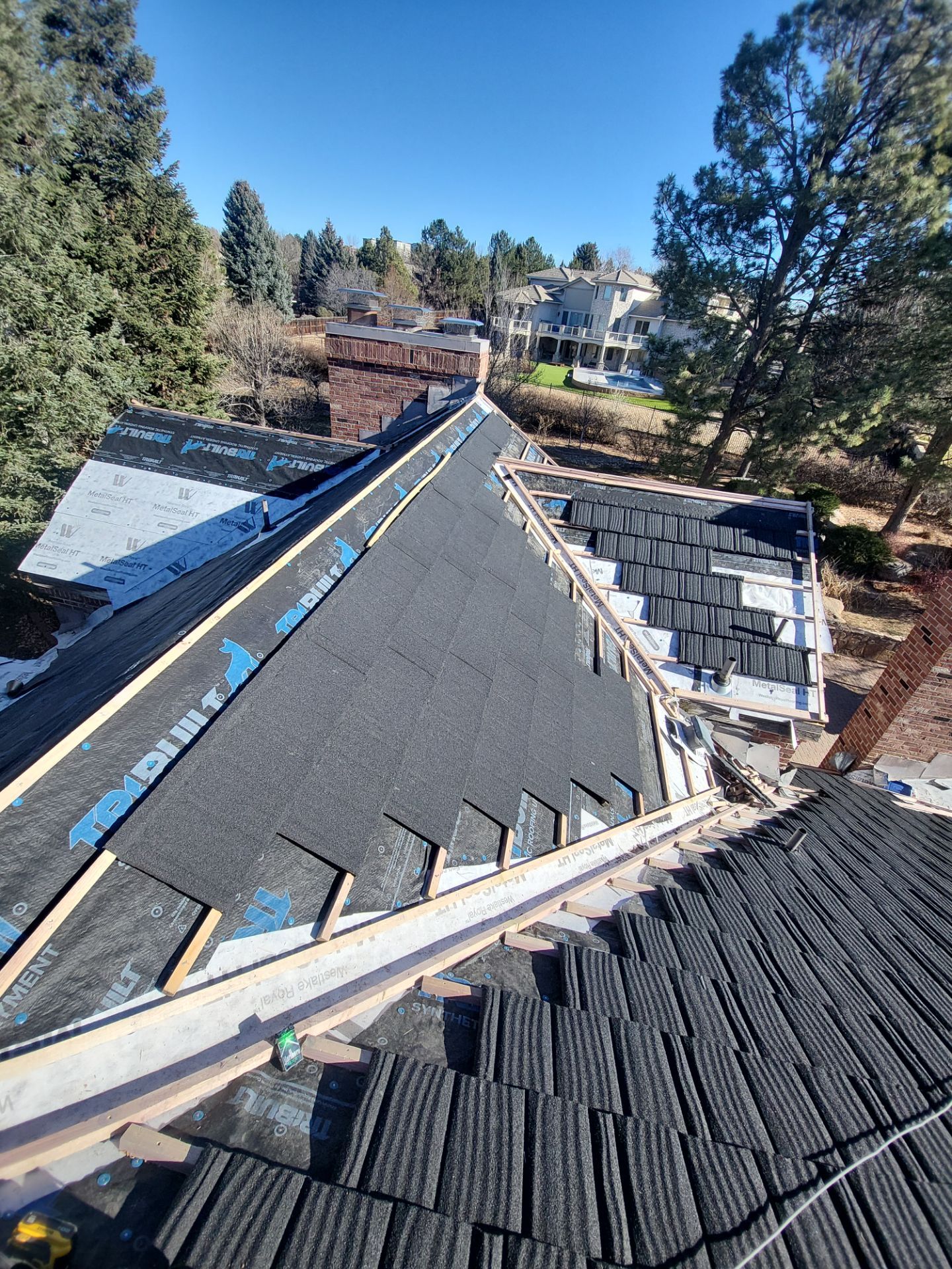 Unified Stone Coated Roof & Stucco Remodle by Blue Peaks Roofing LLC