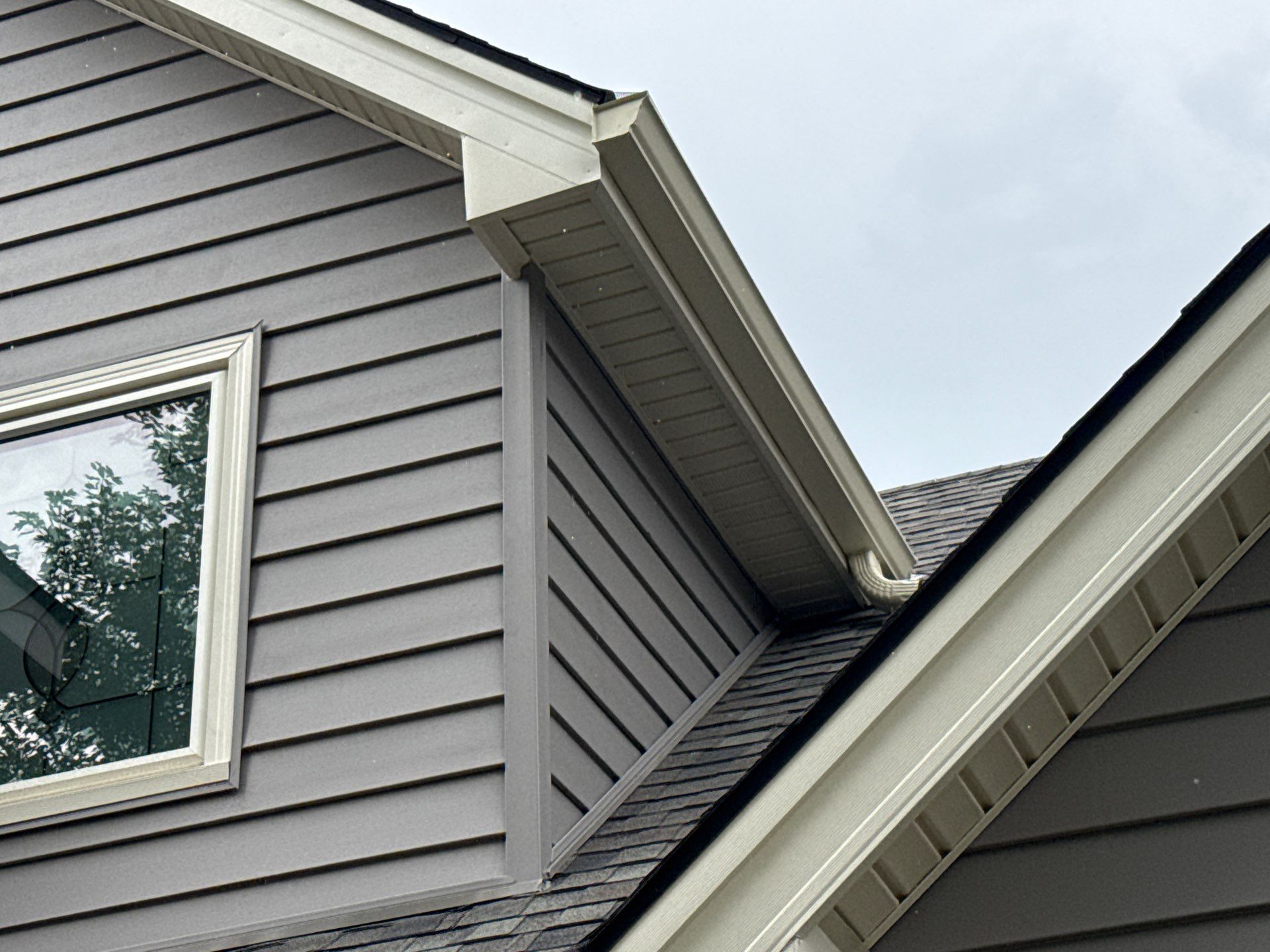 Whole Home Siding Replacement and Gutter Installation in Gladstone by EEC  Windows, Siding & Roofing 