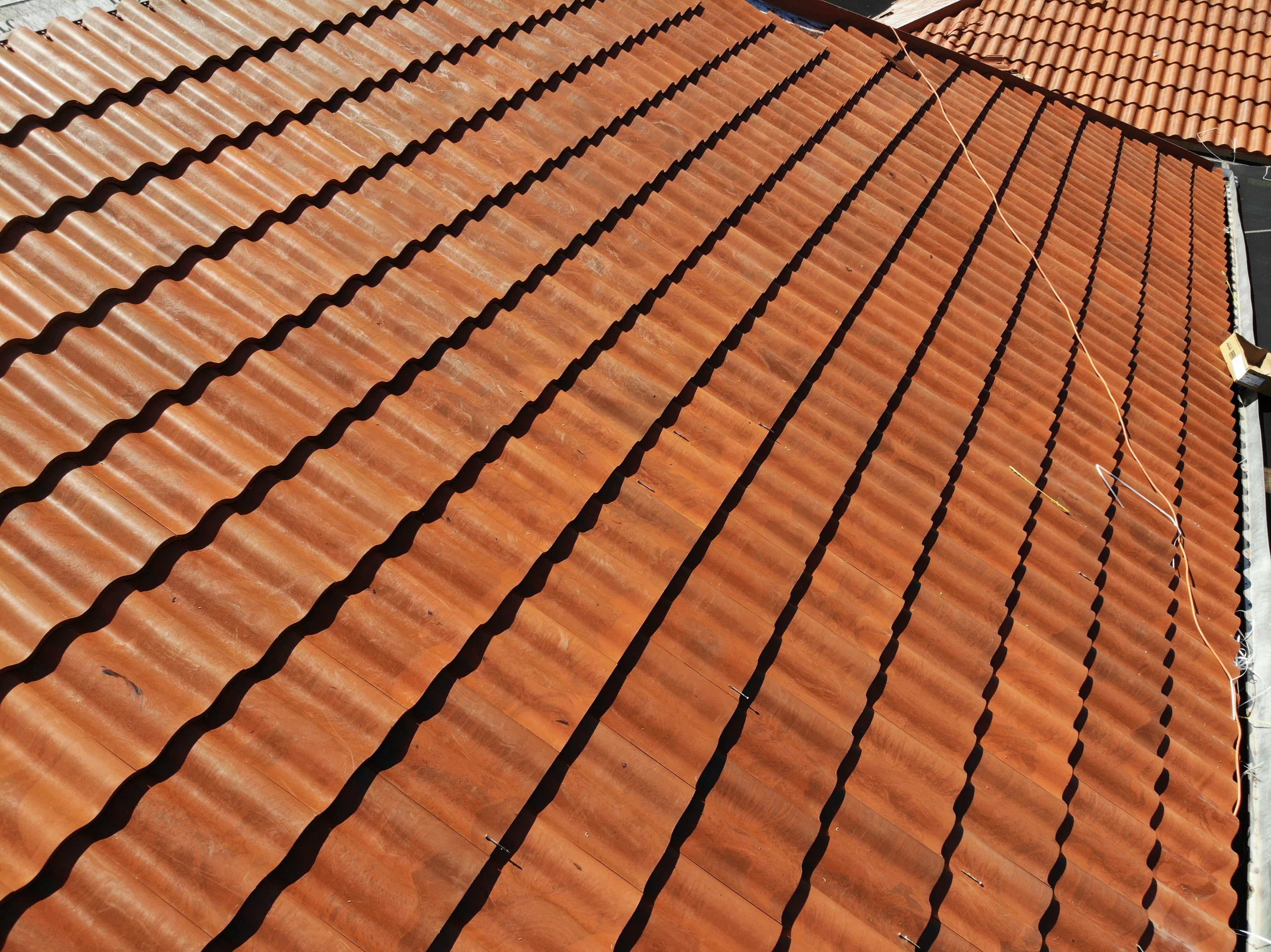 Residential Roofing Installation using Composite Spanish Tile by International Roofing