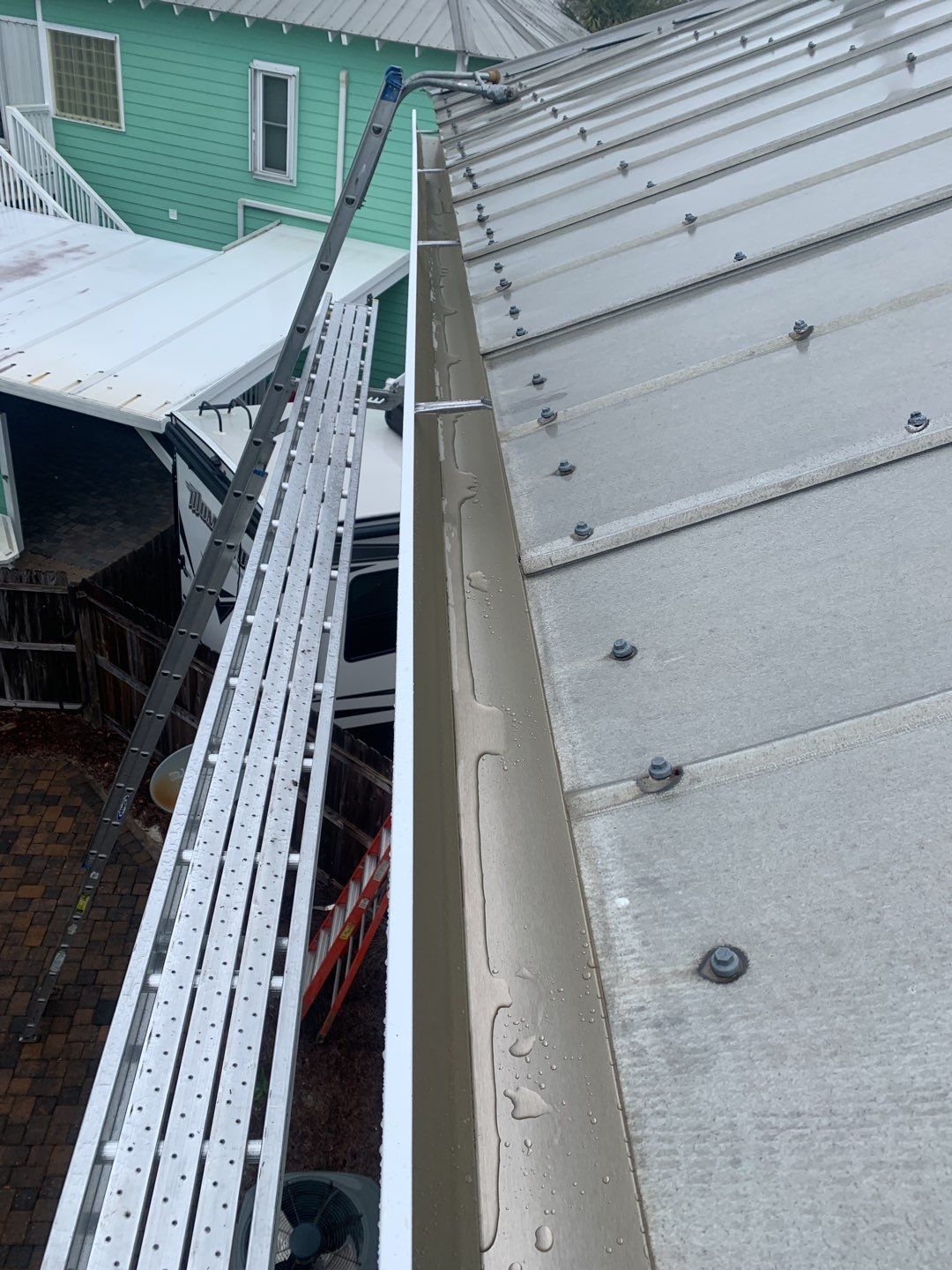 Seamless Gutter Installation Using White K-Style Gutters by Gutter Professors