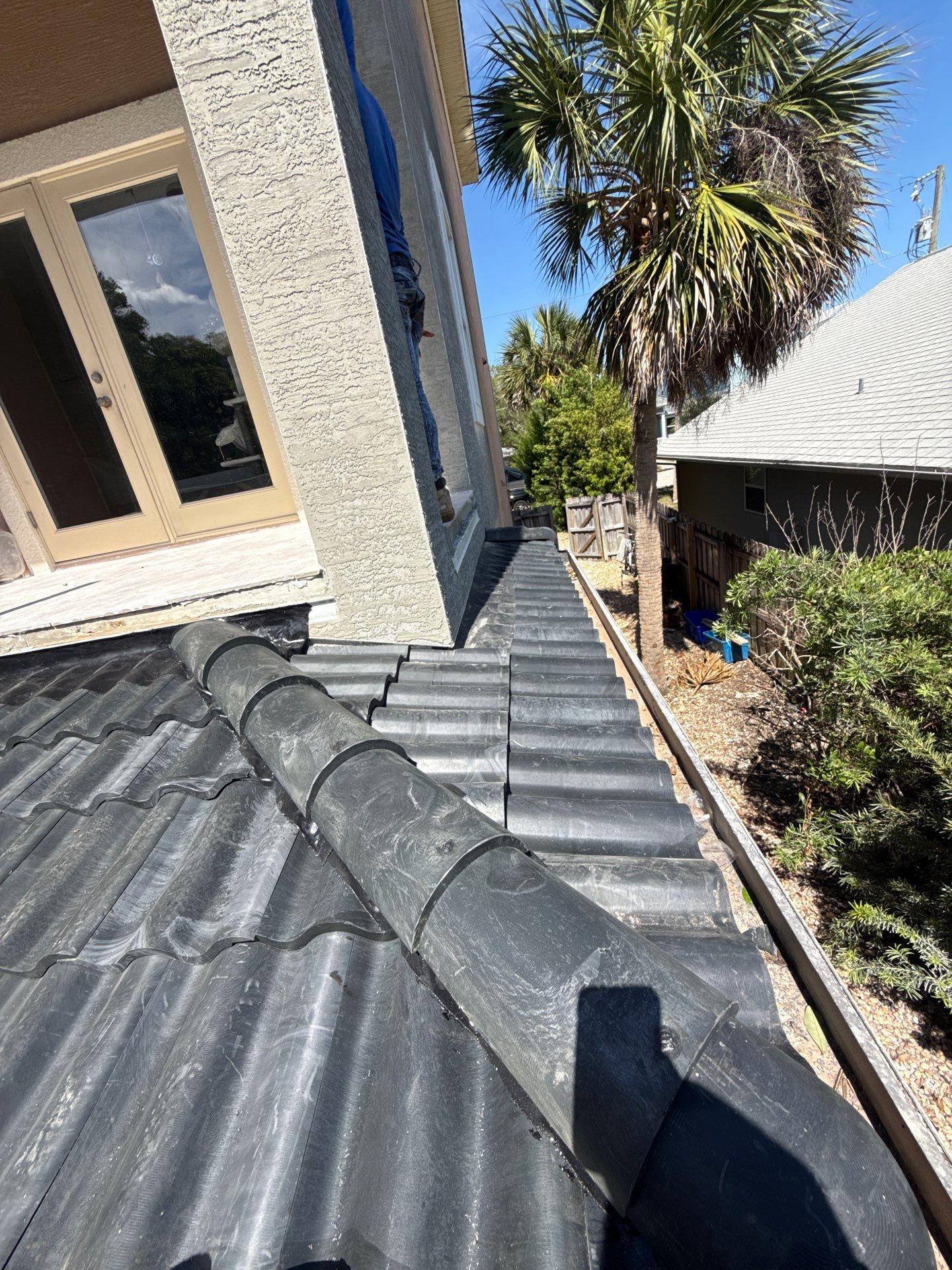 Flagler Beach Residential Tile Roof Replacement with Dark Barrel Tiles by Fortified Roofing Solutions Corp.