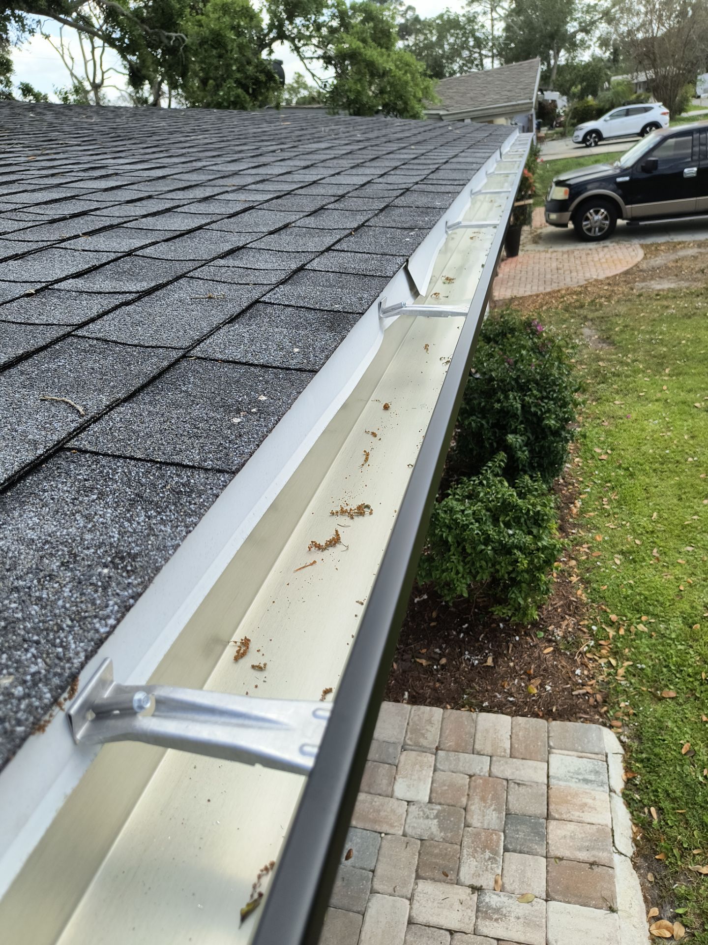 Black Seamless Gutters using 7 inch seamless gutters & New White Soffit in Sarasota FL