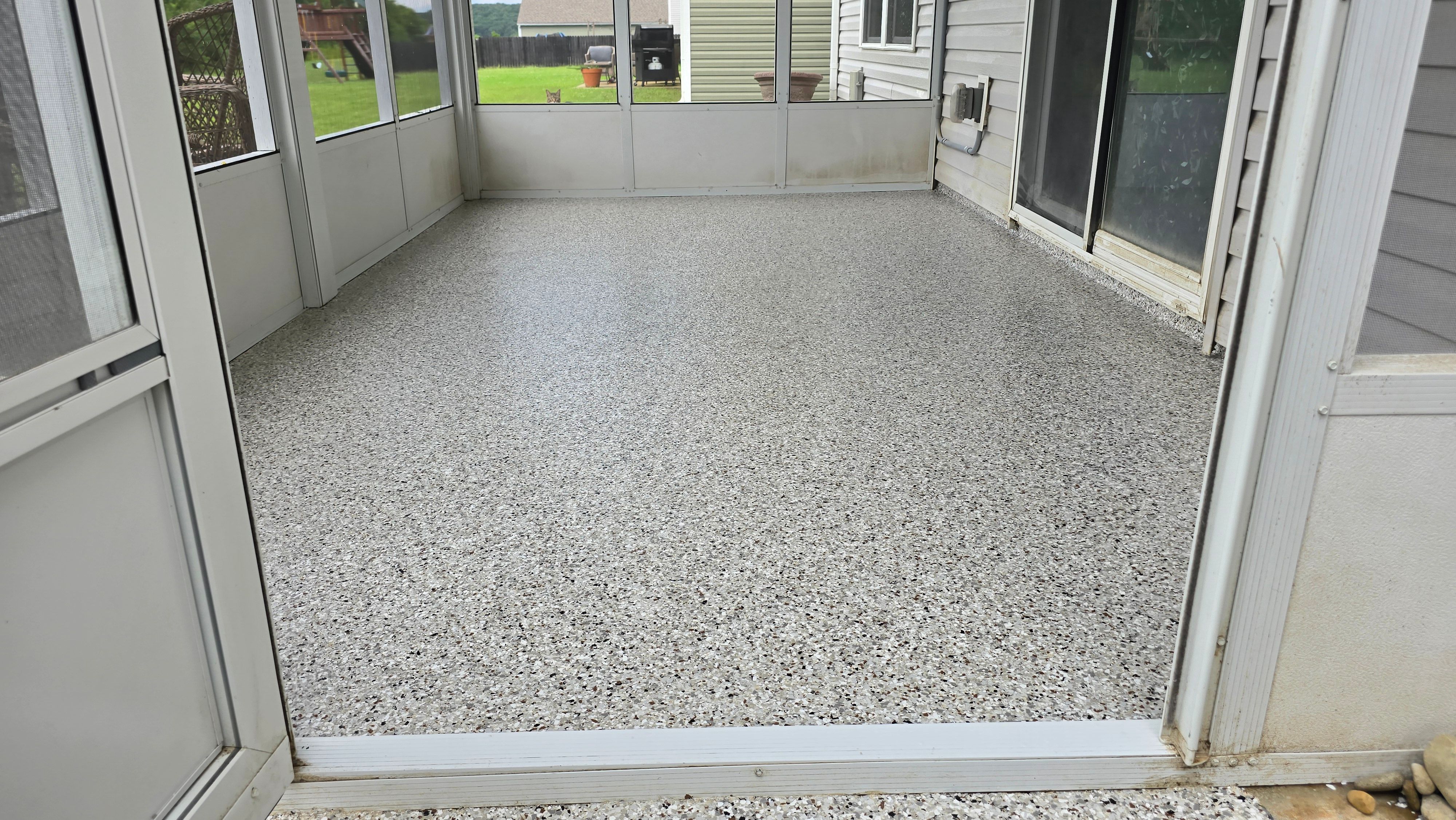 Garage & Back Porch Using Shoreline & Coyote by Elite Floor Solutions
