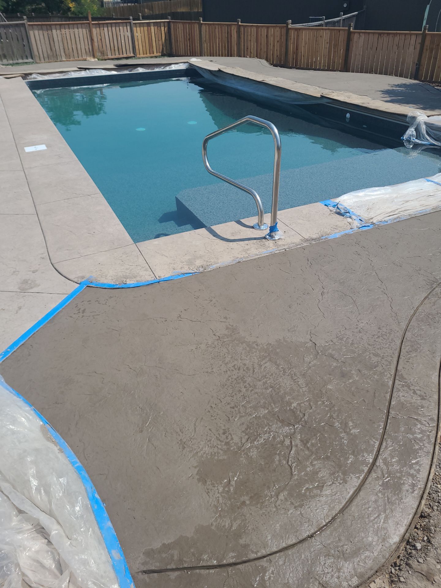 Back Yard Pool Patio by LAND ESCAPES LLC