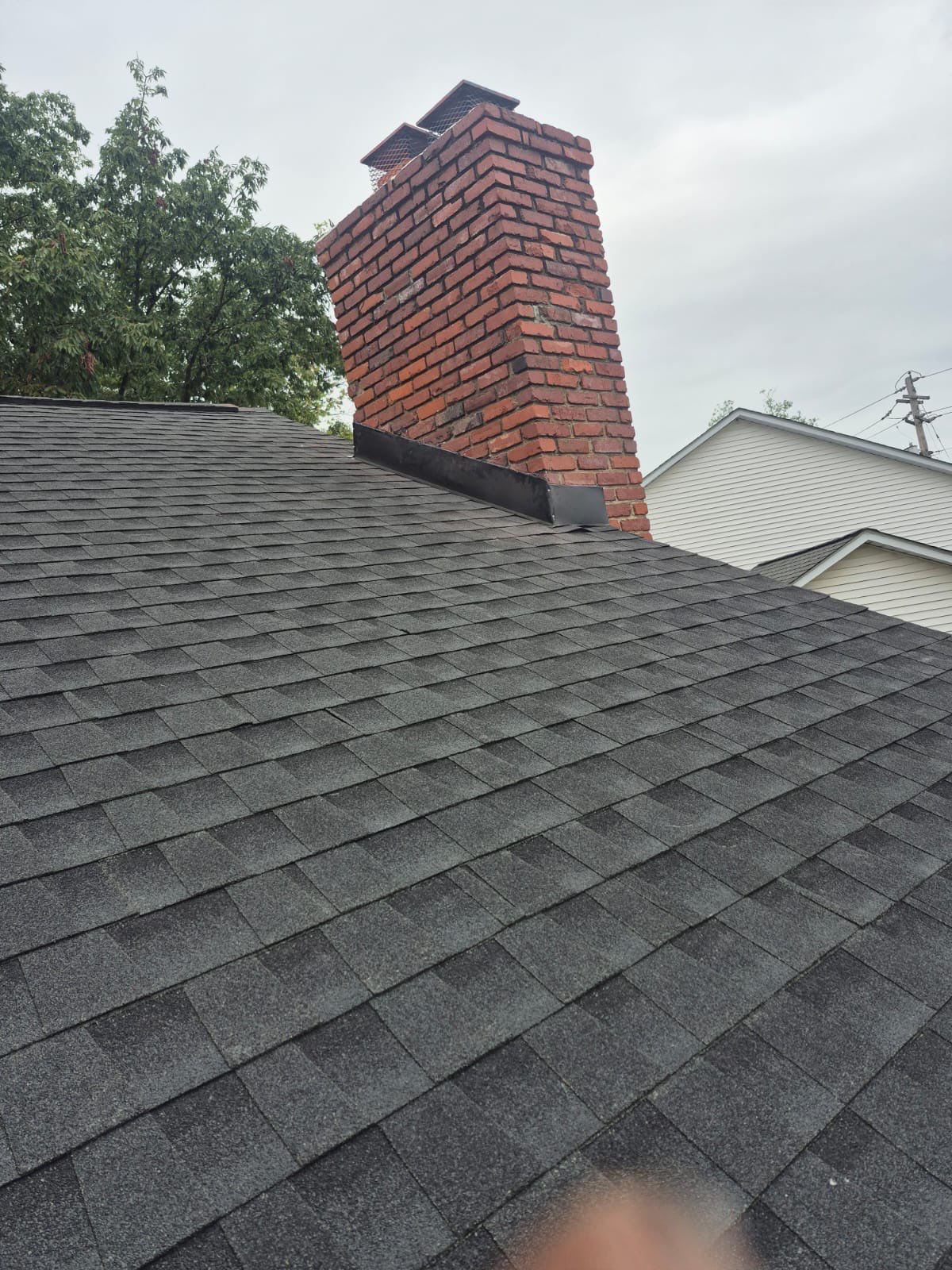 Residential Roofing Installation using GAF Timberline HDZ Charcoal by Rainstoppers Roofing