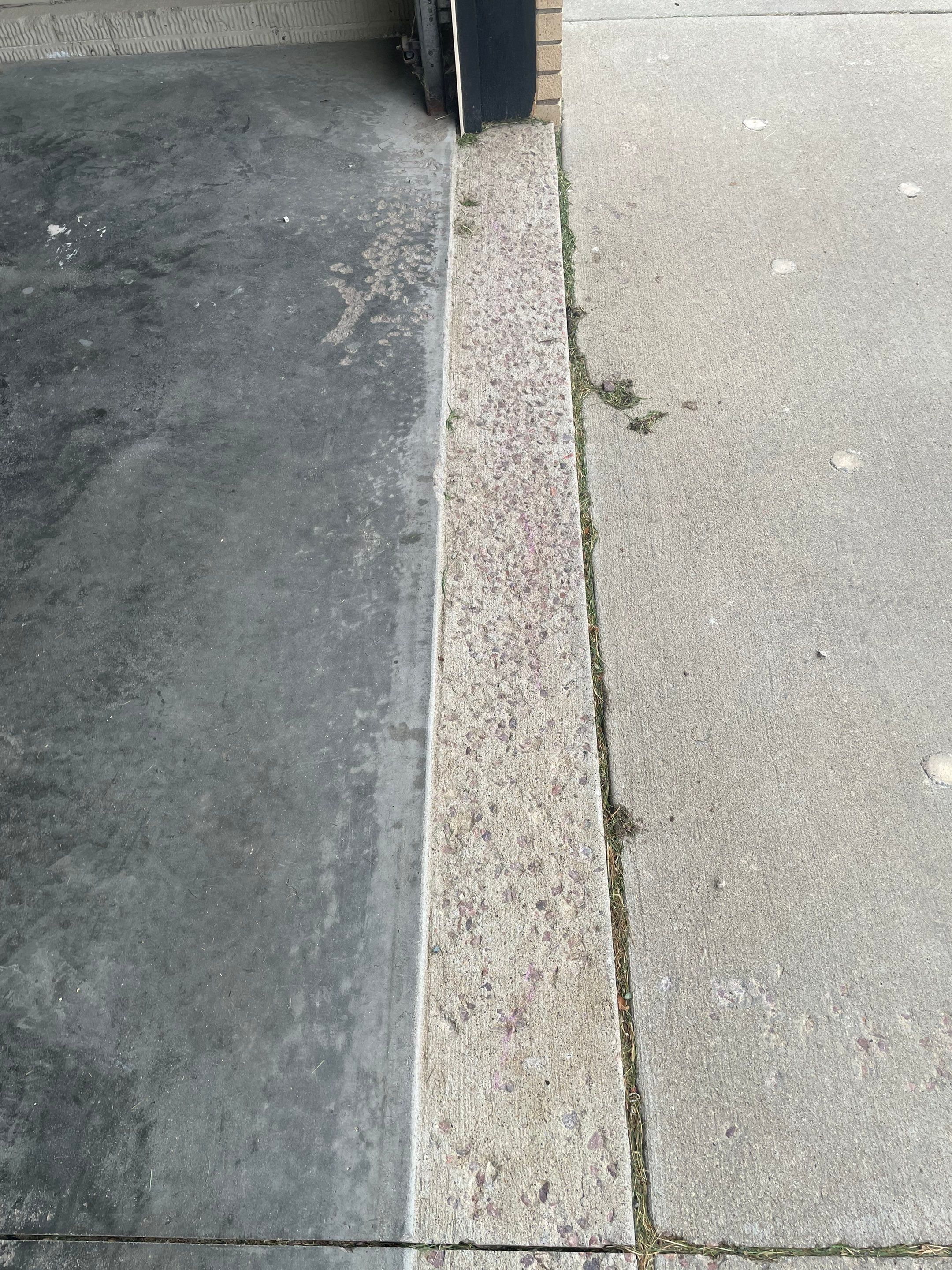 Cabin FEver Flake Garage Floor Coating Installation in Sioux Falls by Select Painting, Coatings & Garage Cabinets