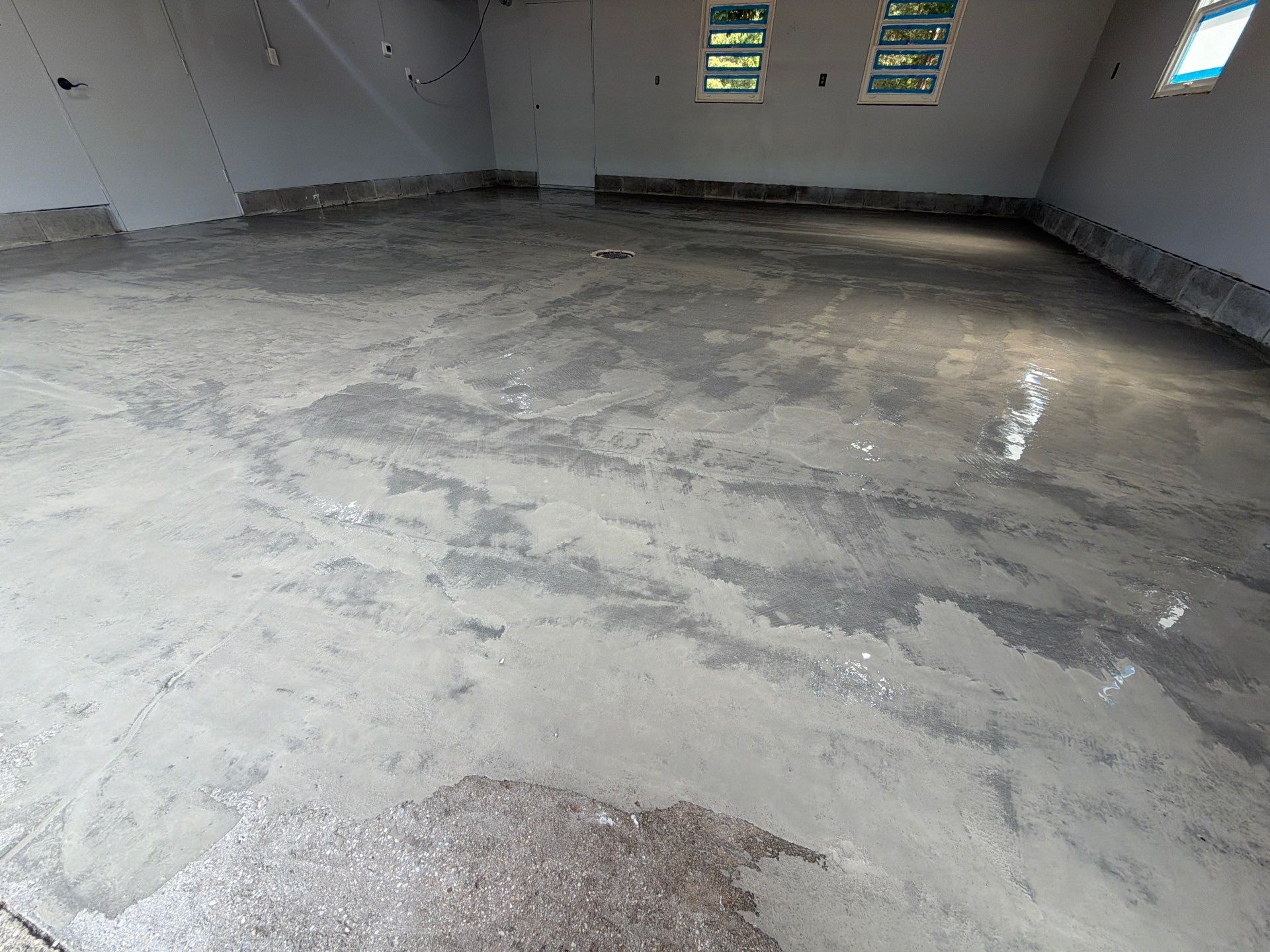 Garage Epoxy Flake Floor Installation and Exterior Siding Repairs in Muskegon by Gordon Painting