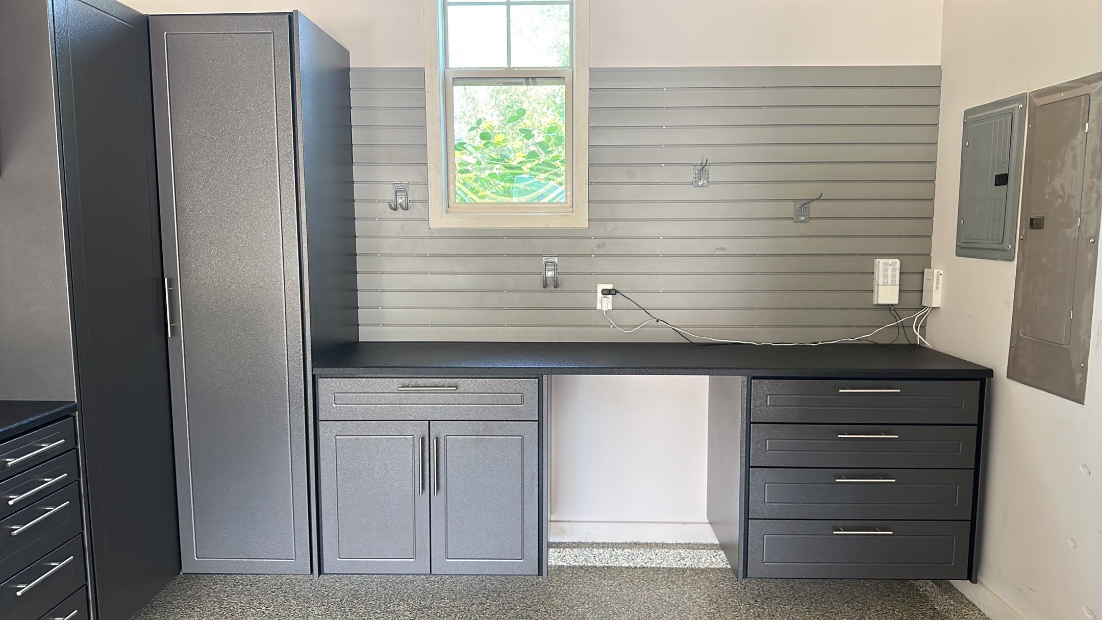 Lori H. upgrade her garage with cabinets and overhead racks by Banner Garage