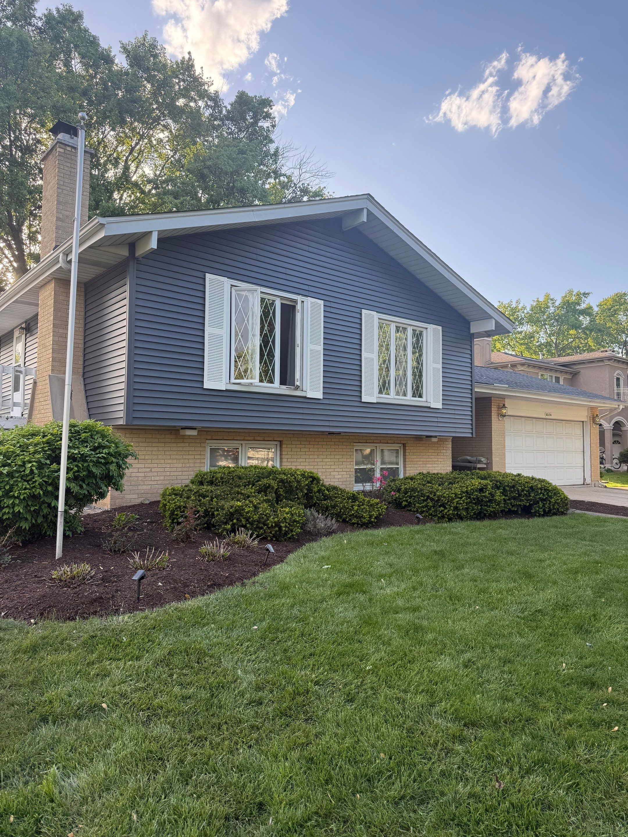 Roof replacement and chimney flashing by Optimal Home Improvement 
