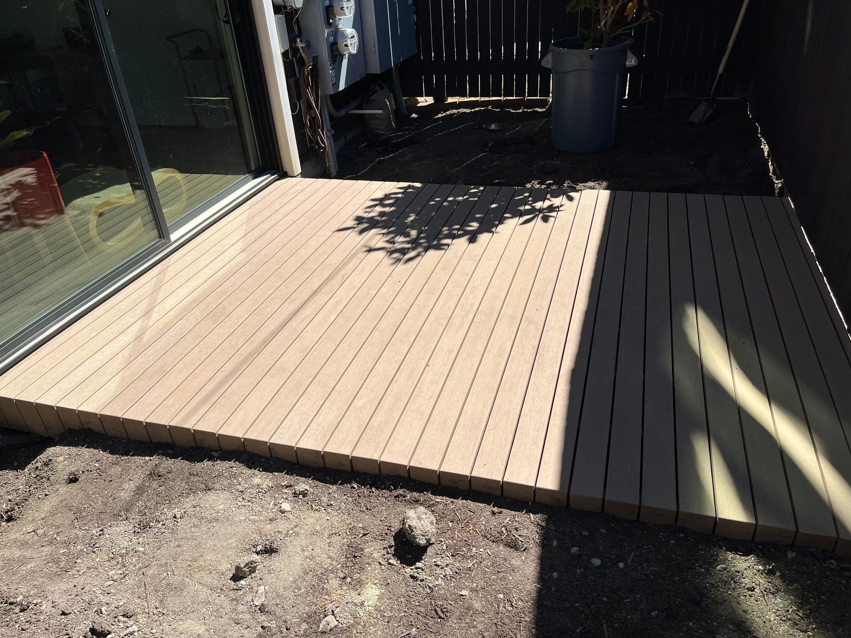 Modern Backyard Deck by Alki deck builders 